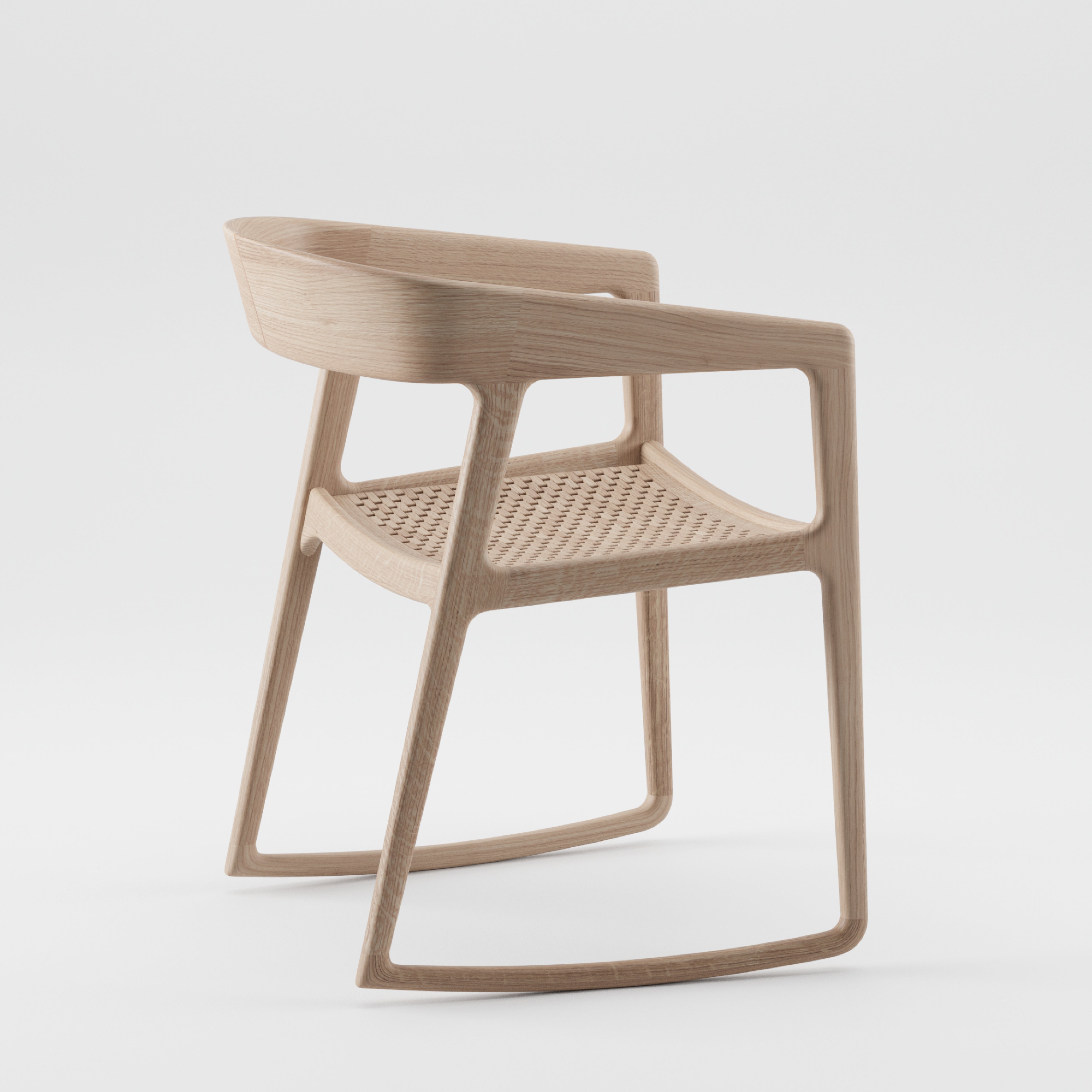 The Artisan TESA SWING CHAIR is a minimalist modern wooden chair crafted from solid wood featuring a curved backrest, open sides, and a woven seat. Enhanced with natural oils, its sleek and eco-friendly design stands out against a white background.