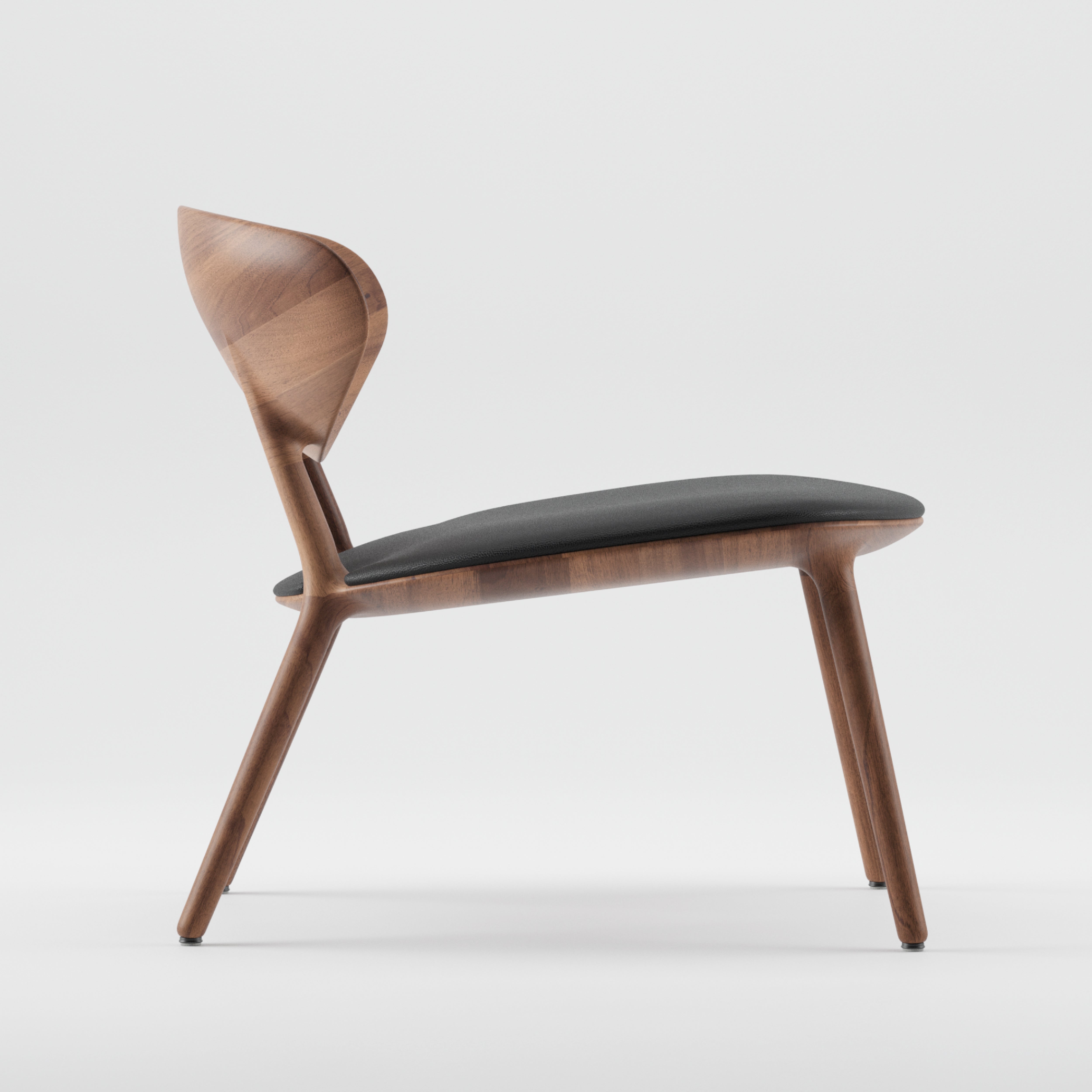 Side view of the WU Lounge Chair by Artisan, showcasing a luxurious wood texture and gently curved backrest. Sleek legs and a cushioned dark fabric seat embody minimalist elegance, crafted from eco-friendly materials, all set against a plain white background.