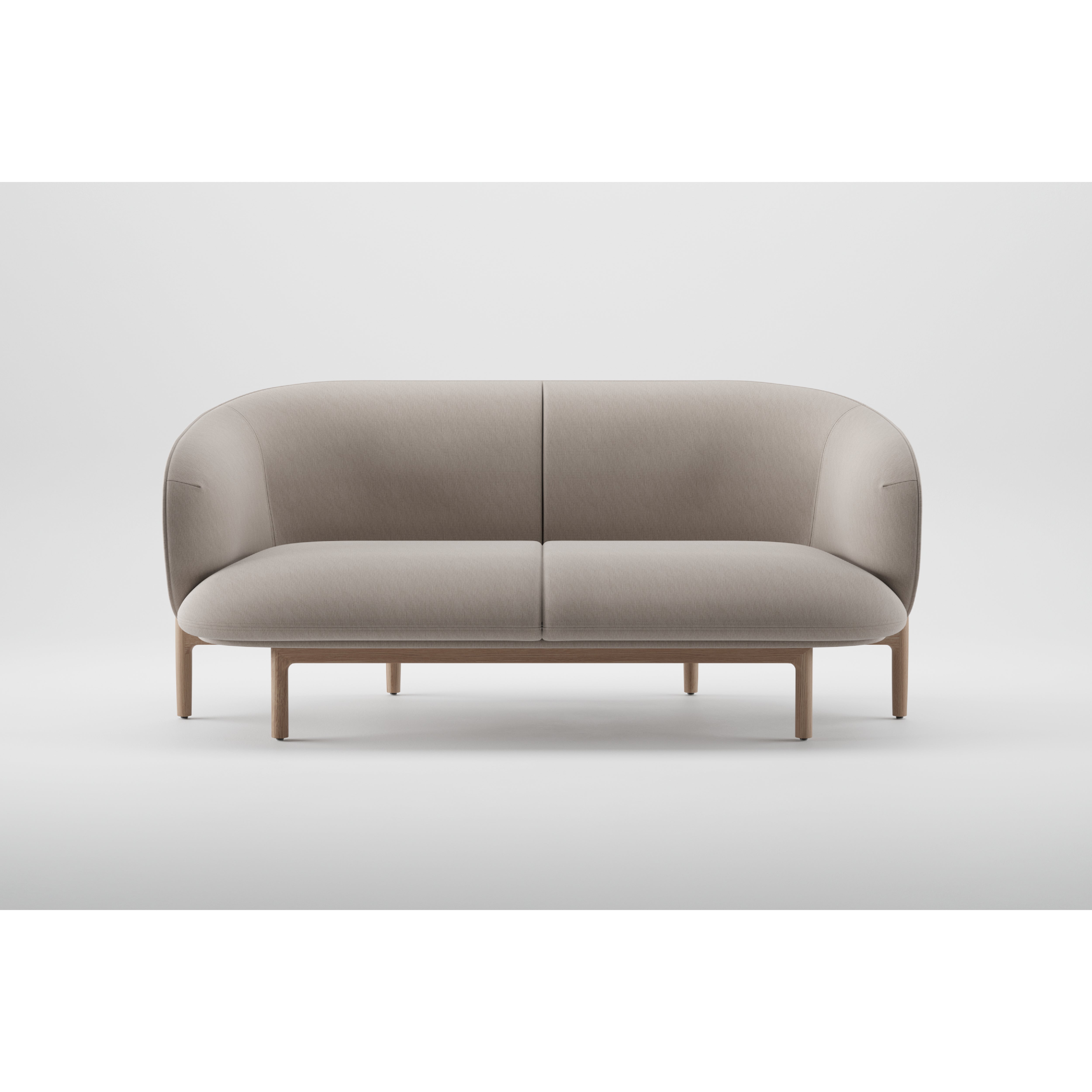 Part of Artisans MELA collection, the two-seater boasts a modern minimalist design with a curved backrest and wooden legs. Upholstered in light gray fabric, it creates a stunning contrast against a plain white background.