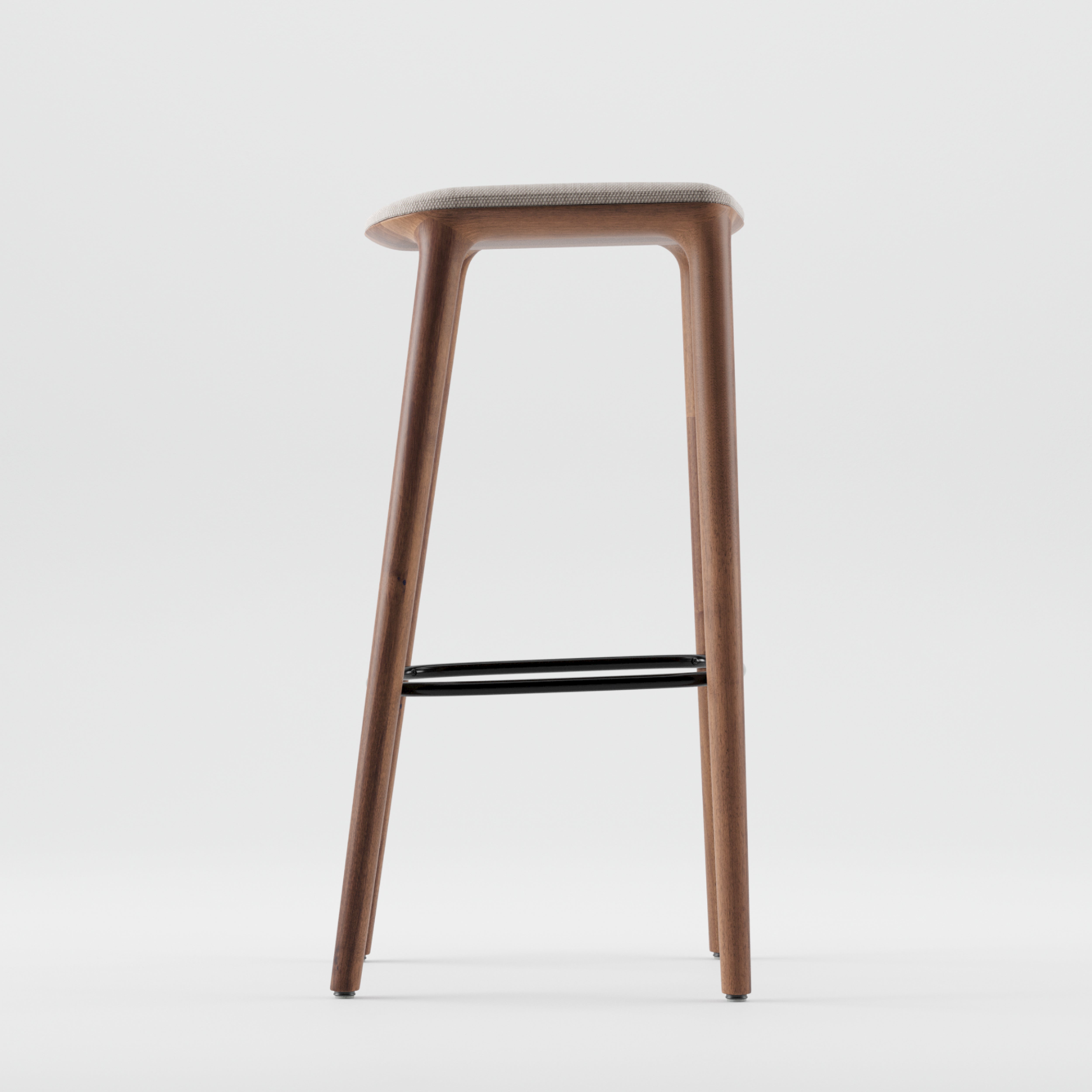 The NEVA barstool from Artisan features a minimalist wooden design with a light cushioned seat and sleek black footrest, crafted with precision for modern elegance against a plain white background.