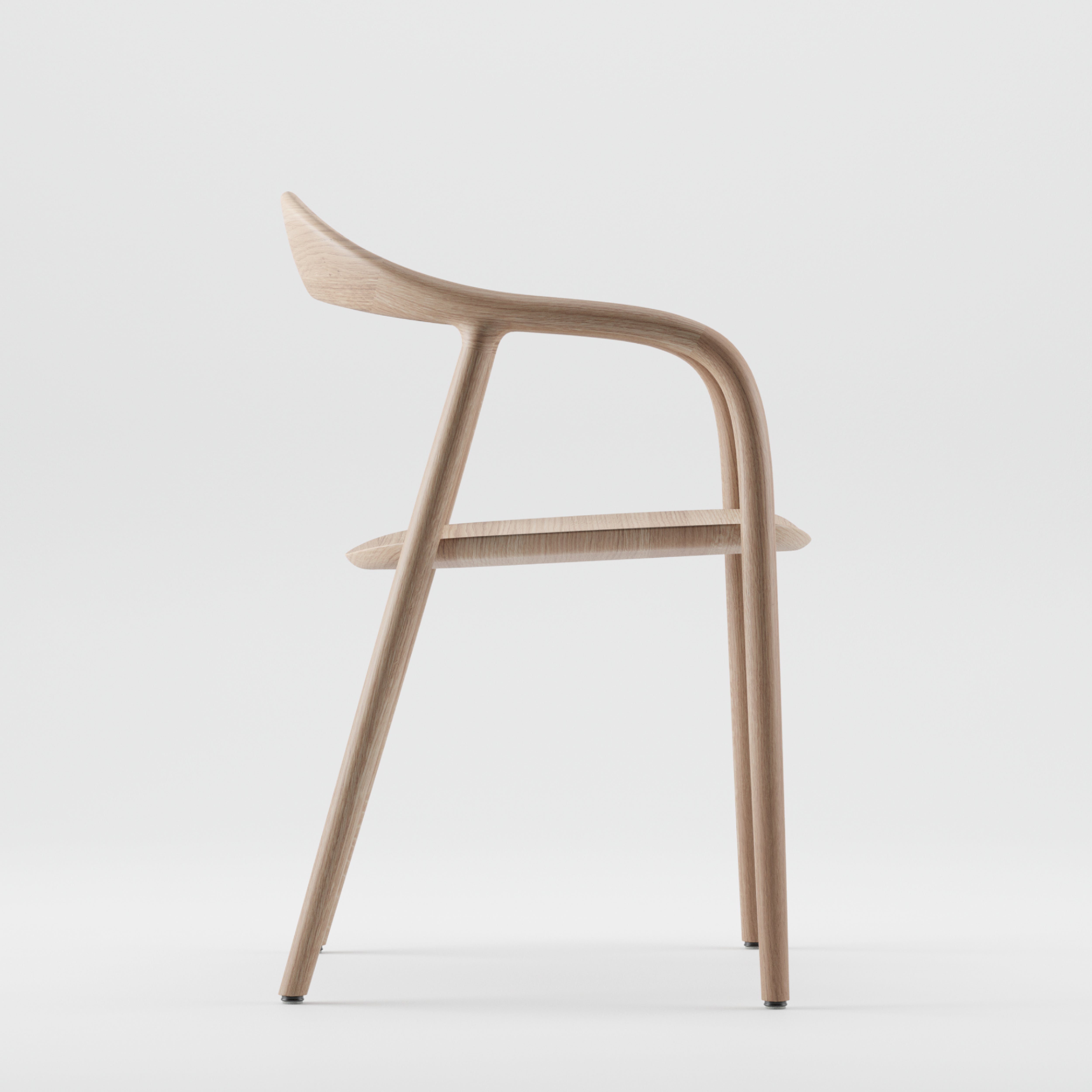 Side view of an Artisan NEVA chair made from American walnut against a plain backdrop, showcasing its sleek, curved design with a smooth finish and slightly angled backrest, highlighting 5-axis CNC precision.