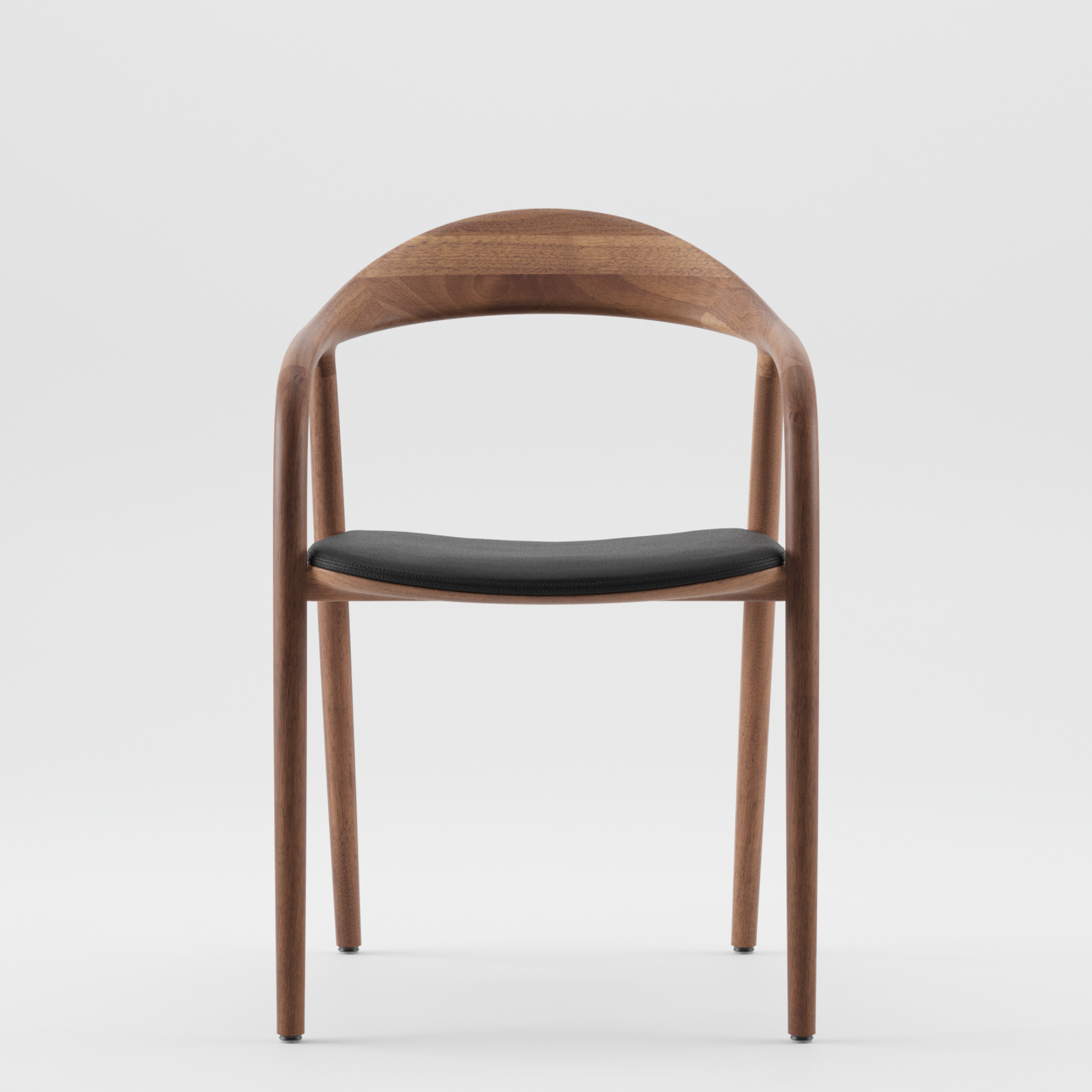 Presenting Artisans NEVA chair: a sleek modern design in American walnut with a curved backrest, armrests, and black cushioned seat. The advanced 5-axis CNC technology enhances its natural wood tones for a flawless minimalist style.