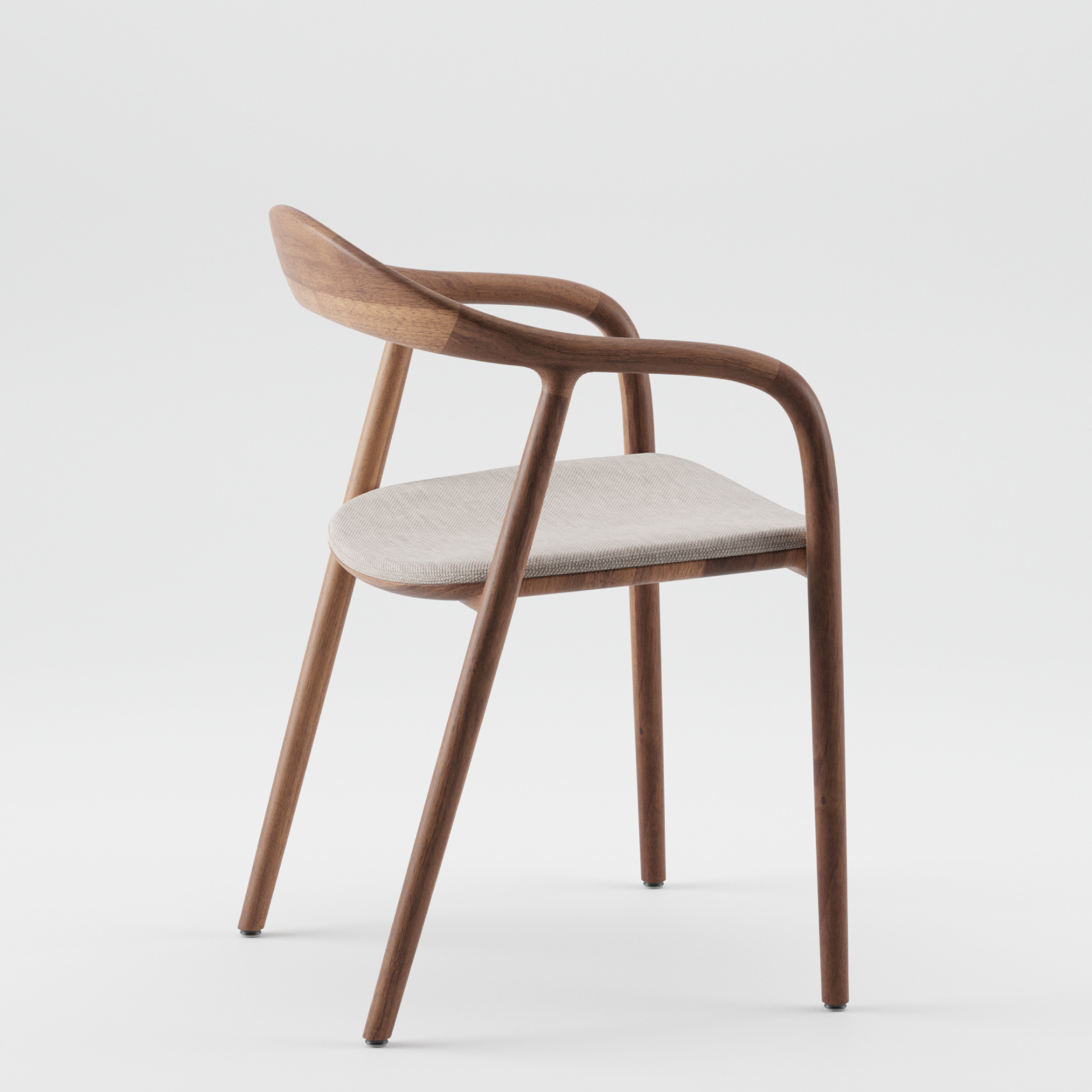An Artisan NEVA chair, made from American walnut with smooth, curved armrests and a light seat cushion, is set against a plain white background.