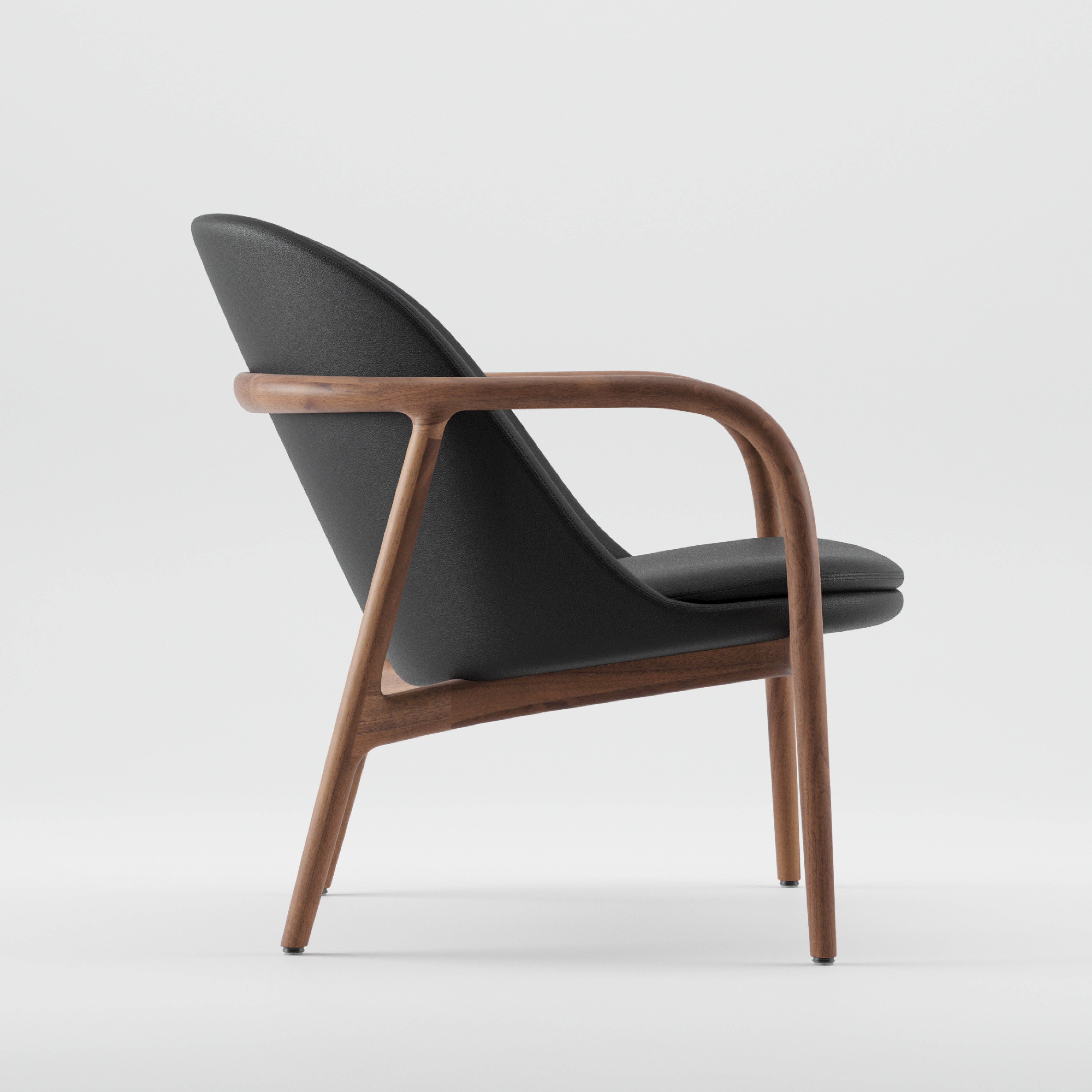 A side view of the NEVA Lounge Chair Trimmed by Artisan shows its dark upholstered seat and backrest. Supported by a wooden frame with curved armrests and legs, it stands against a plain white background.