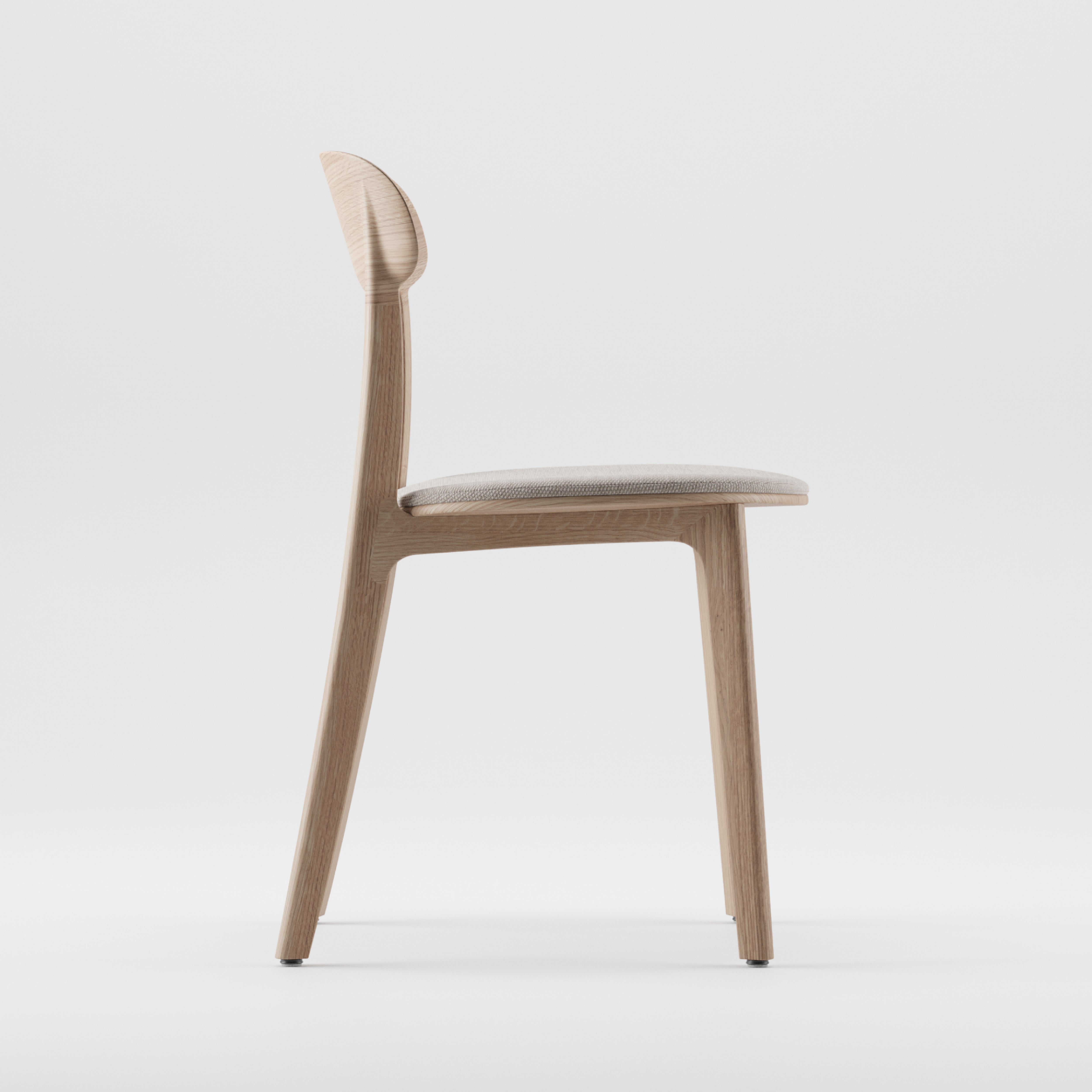 Side view of the Artisan TANKA Chair, showcasing a minimalist design with natural finishes, a light seat cushion, and a solid wood backrest against a plain white background.
