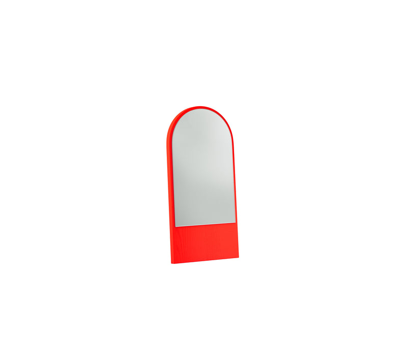 The Friedrich Mini Mirror by Objekte unserer Tage features a tall, arched shape with a striking red frame against a plain white background. Its bold border contrasts beautifully with the reflective glass, emphasizing its simple, modern design.