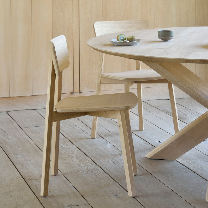 Casale Dining Chair by Studio Kaschkasch in varnished oak with straight lines and a smooth, delicate shape.