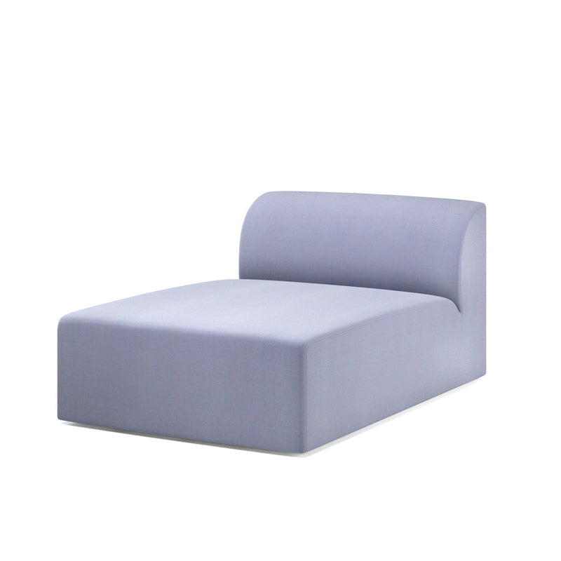 The Weber Modular Sofa by Objekte unserer Tage showcases German craftsmanship with a minimalist, modern design. This light grey chaise lounge features a smooth, boxy shape and a curved backrest, all set against a plain white background.