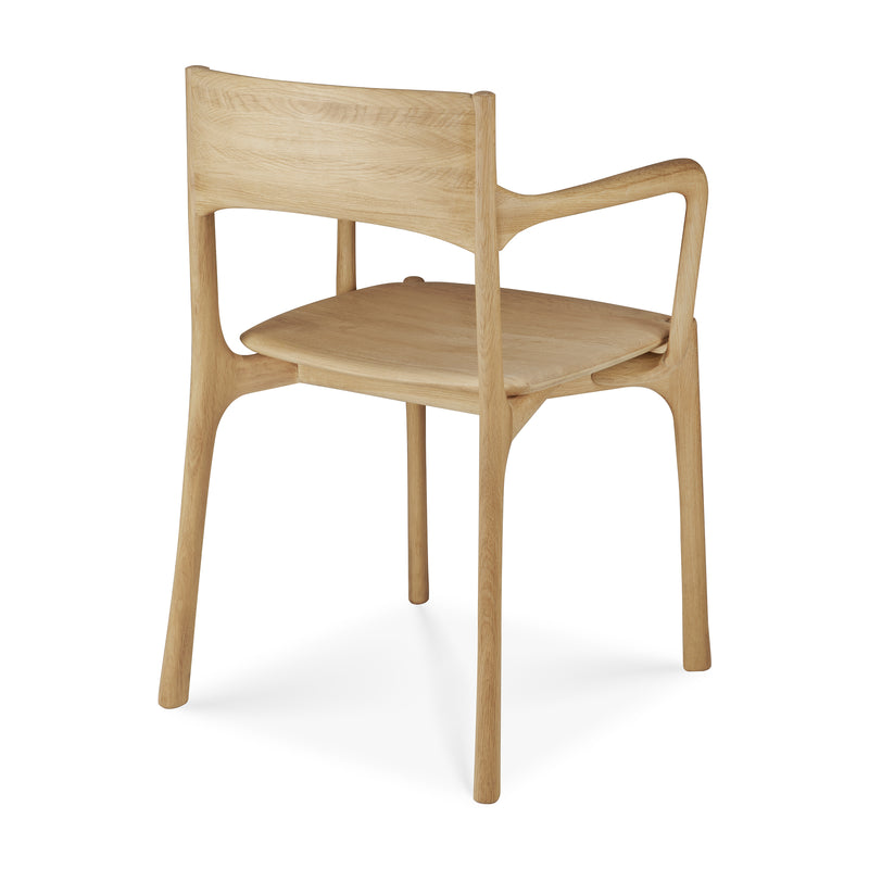 Pi Dining Chair with Armrest in polished oak wood featuring sleek natural curves and hand-finished craftsmanship.