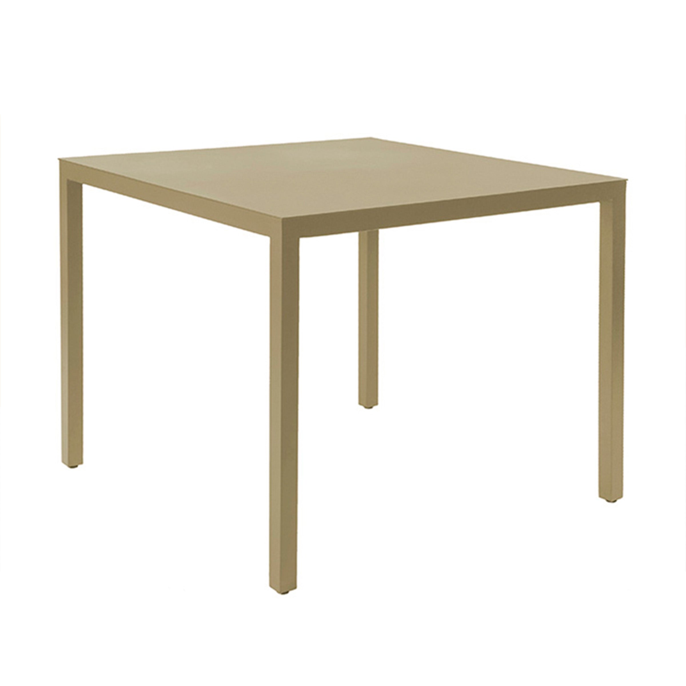 The Resol Barcino Table is minimalist with a light beige finish and straight, slender legs crafted sustainably. It stands on a plain white background, highlighting its simple and modern design.