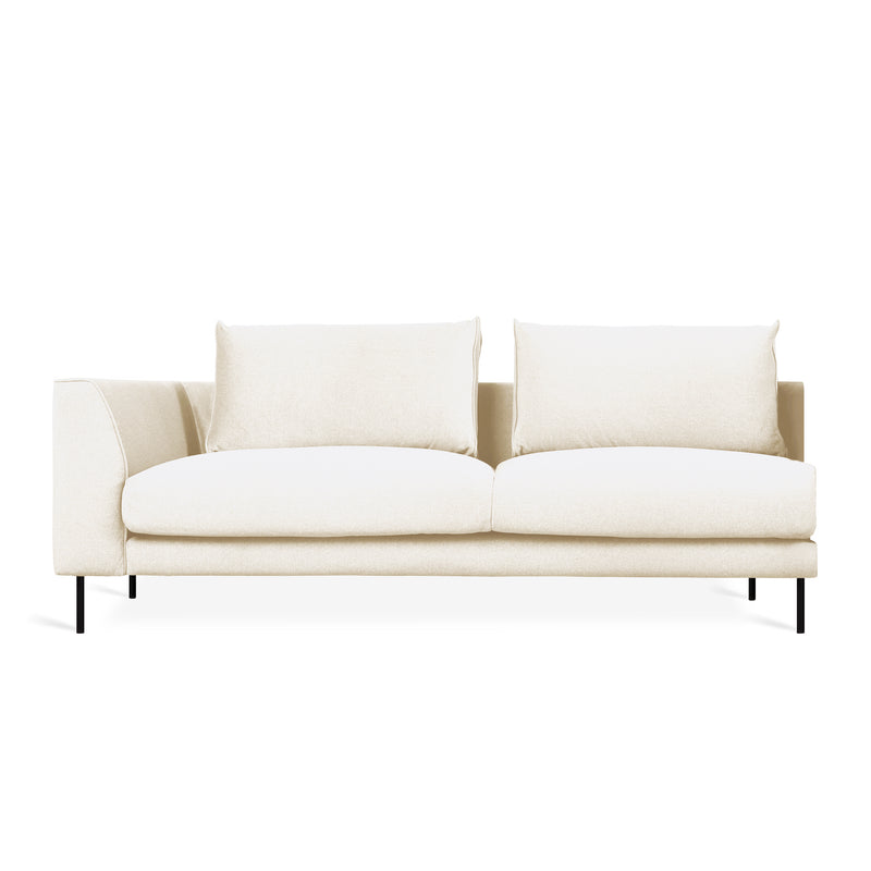 Three-seat cream fabric sofa with left armrest and slender black metal legs on white background