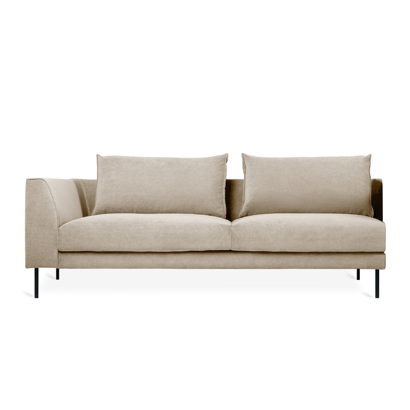 Minimalist beige fabric sofa with left-side armrest, two large seat cushions, and slim black metal legs on white background