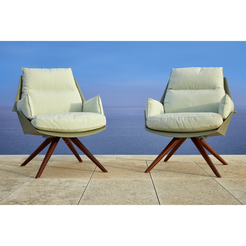 Two Resol Anou Wooden Legs chairs, designed for both indoor and outdoor settings, are positioned on a tiled patio facing each other. Behind them is a tranquil ocean view under a clear blue sky.