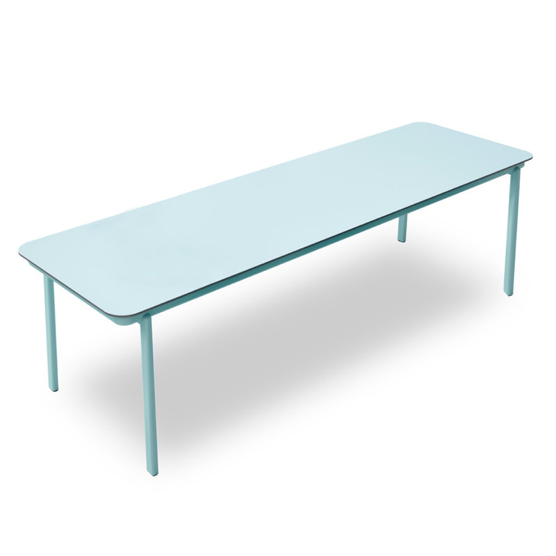 The Anthea Dining Table by Resol is a long, rectangular, light blue aluminum table with four slender legs. It features a smooth, simple design on a white background, ideal for outdoor furniture enthusiasts who value sustainable production.
