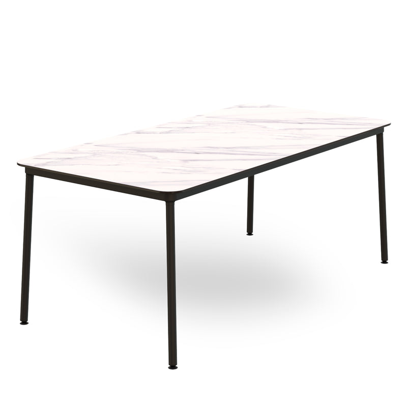 The Hub Table by Resol features a rectangular design with a white marble-like top and black legs. Its minimalist and modern style is ideal for dining or office spaces, embodying sustainable production and innovative design.