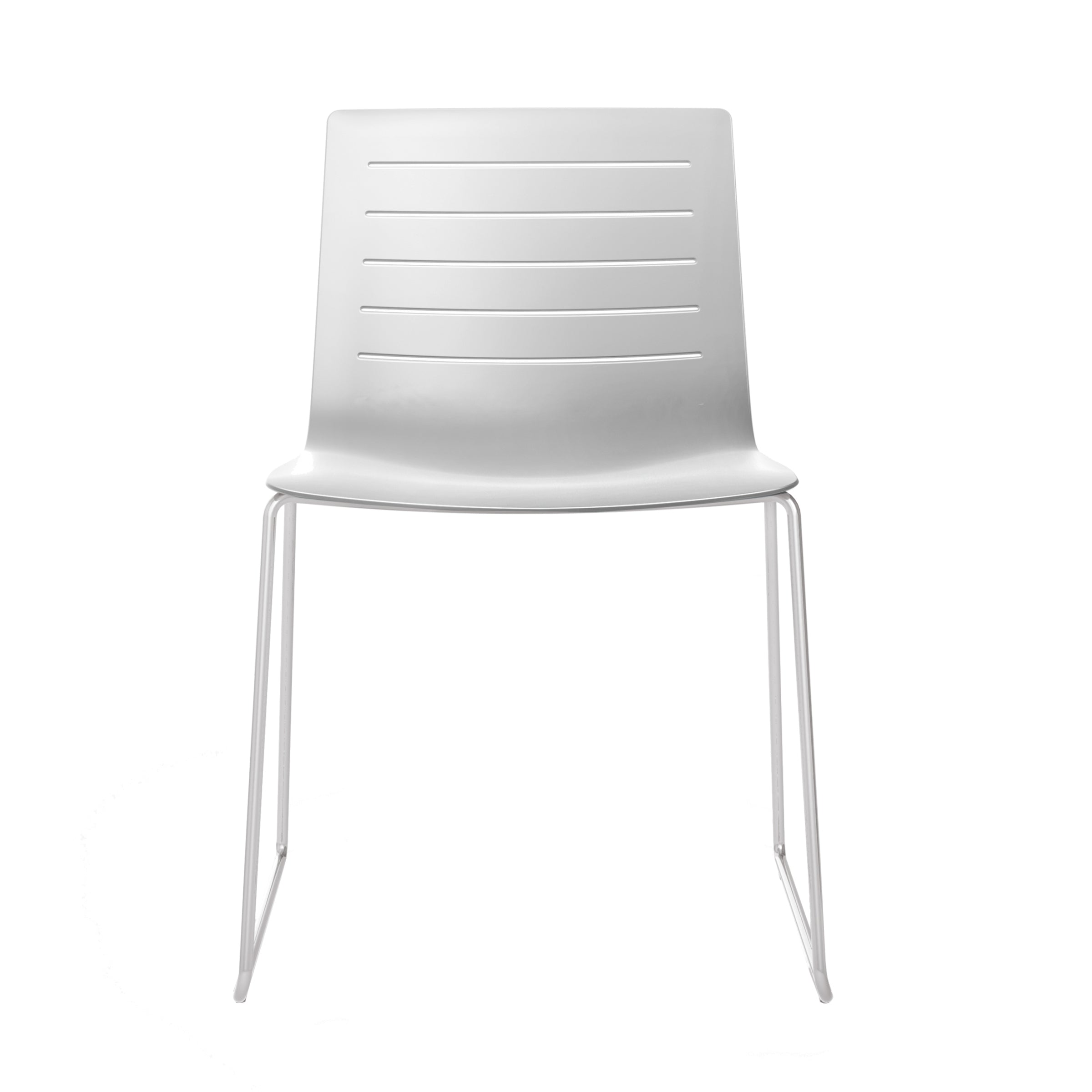 The Resol Skin Sled Chair showcases a minimalist design with a fiberglass and polypropylene seat, horizontal grooves on the backrest, and slender metal legs, beautifully set against a plain white background.