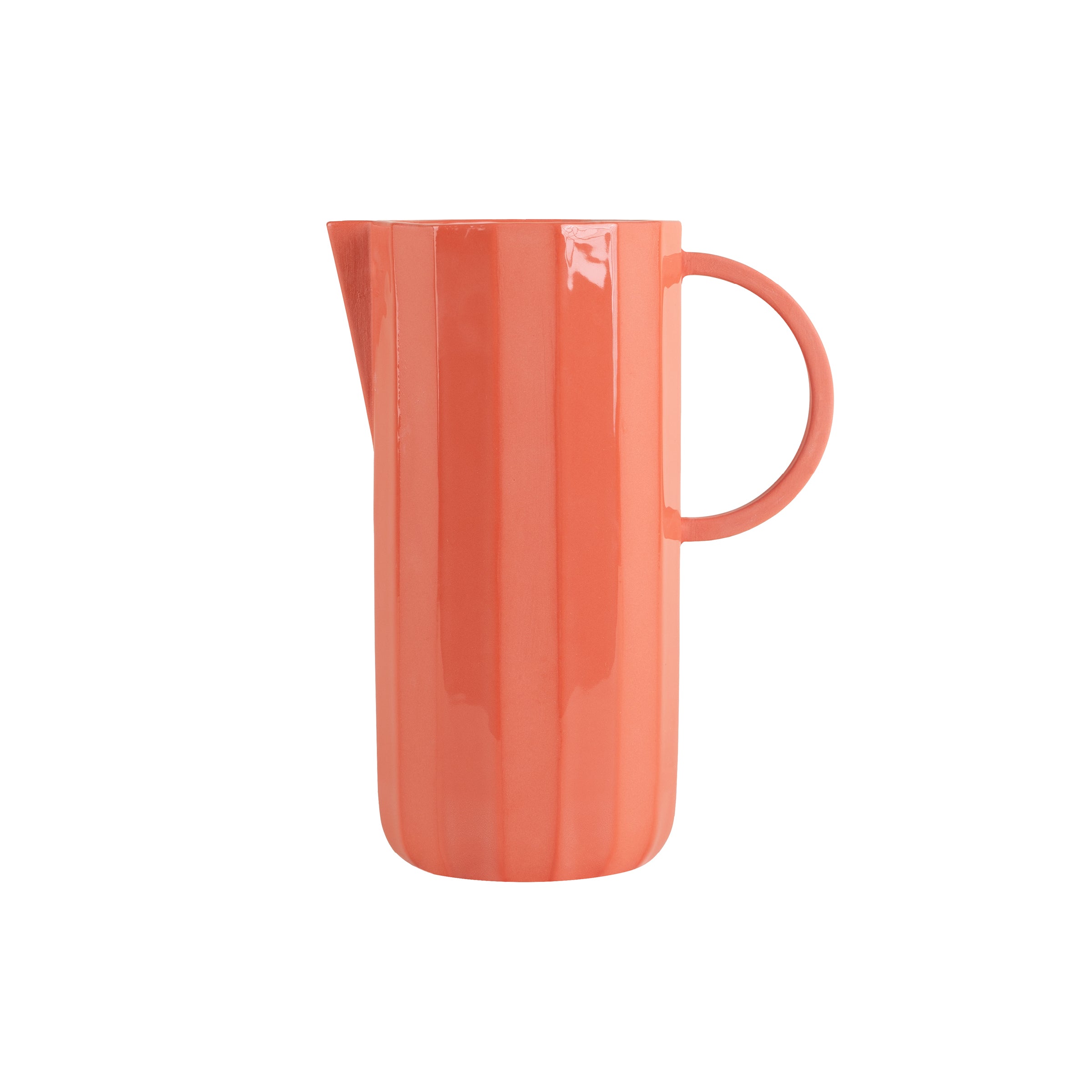 The Facet Tableware - Carafe by Schneid is a tall, glossy coral ceramic design featuring vertical ridges, a narrow spout, and a round side handle, showcasing exquisite color dynamics.