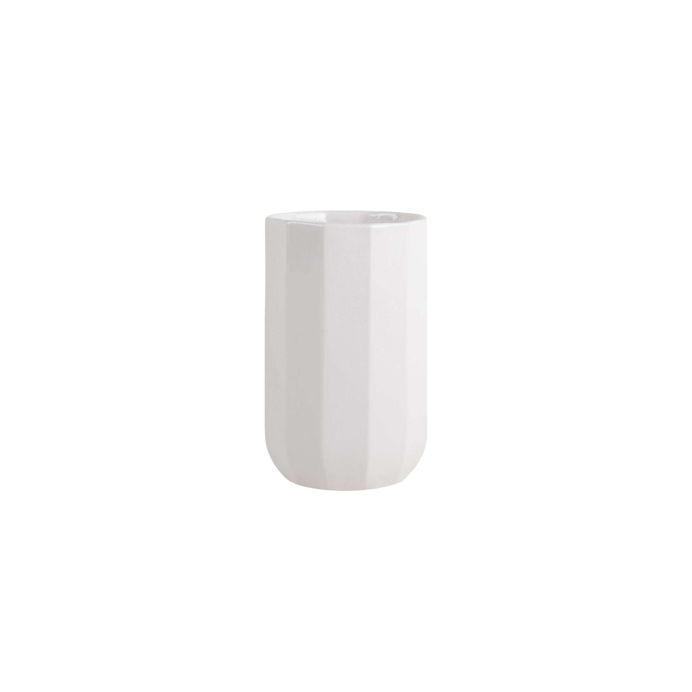 A tall, cylindrical white ceramic vase with a faceted surface echoes the design of Schneids Facet Tableware cup, elegantly set against a plain white background.