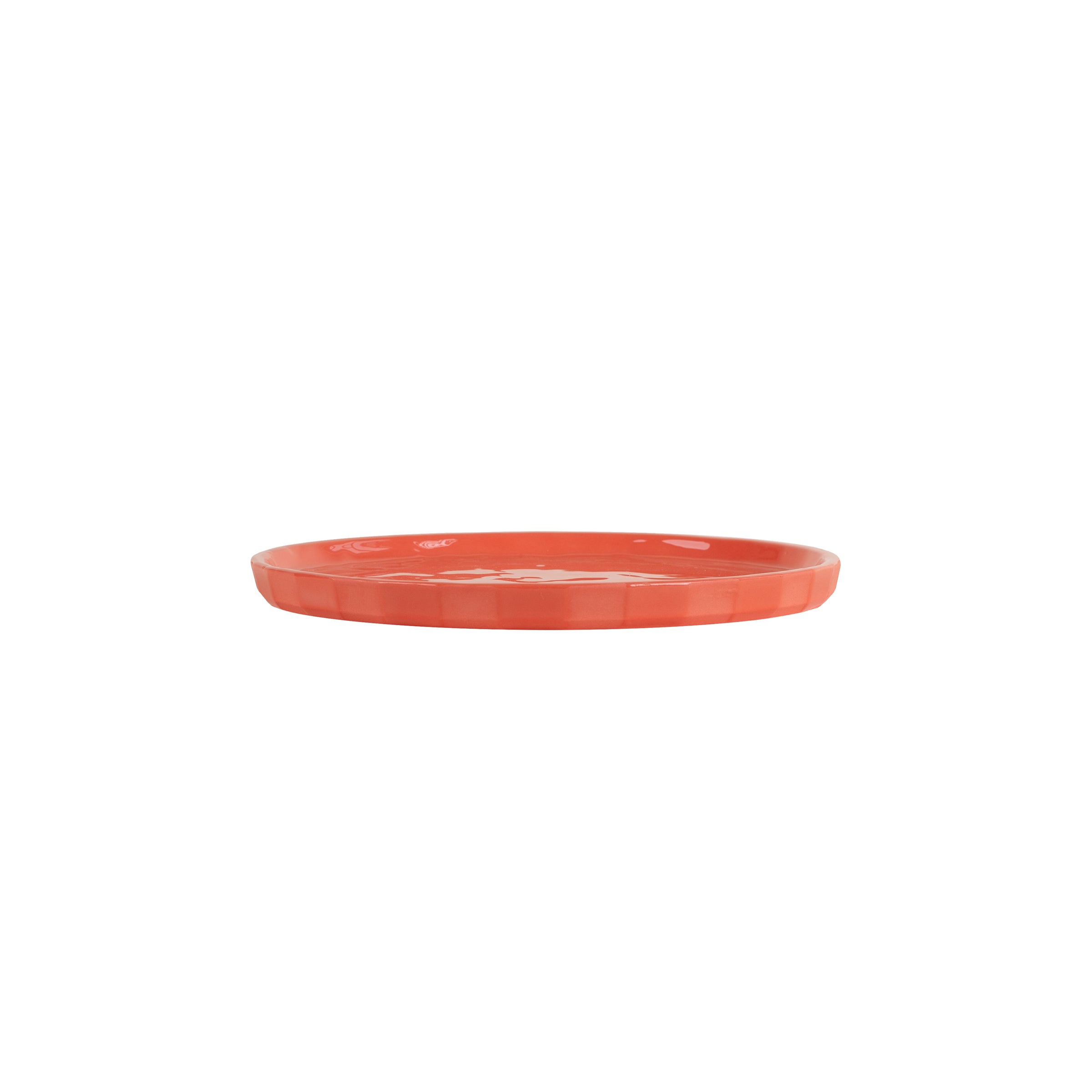 The Schneid Facet Tableware - Plate showcases a flat, round ceramic design in red-orange on a white background with a smooth, glossy finish adorned by an elegant striped pattern.