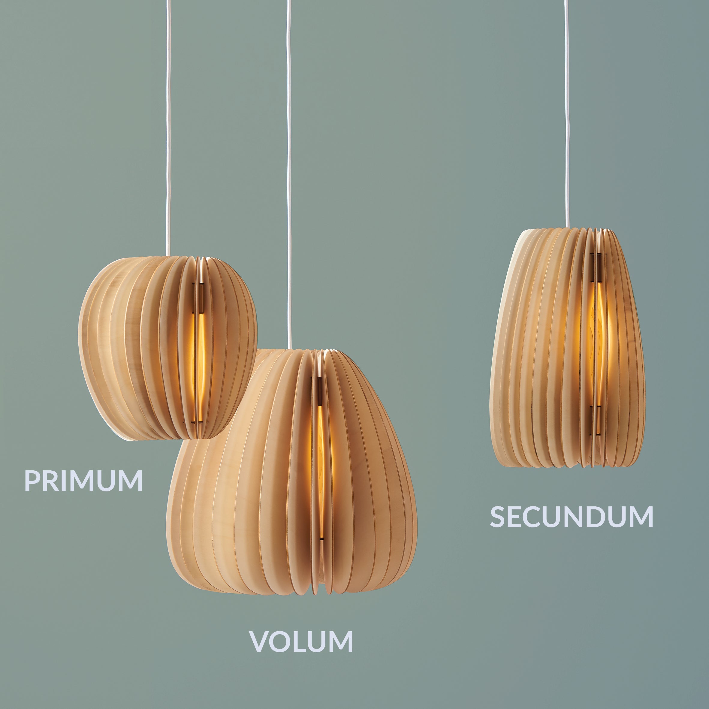 Three wooden pendant lights, labeled Volum - Sale, Primum, and Secundum by Schneid, hang gracefully against a light green background. These lamps feature layered wooden slats enclosing warm glowing bulbs, embodying an organic form that enhances natural ambiance in any space.