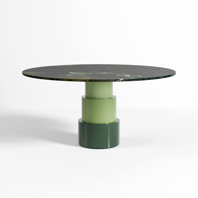 U Turn Table Avocatus with green layered base and round polished Avocatus quartzite top in sage color.