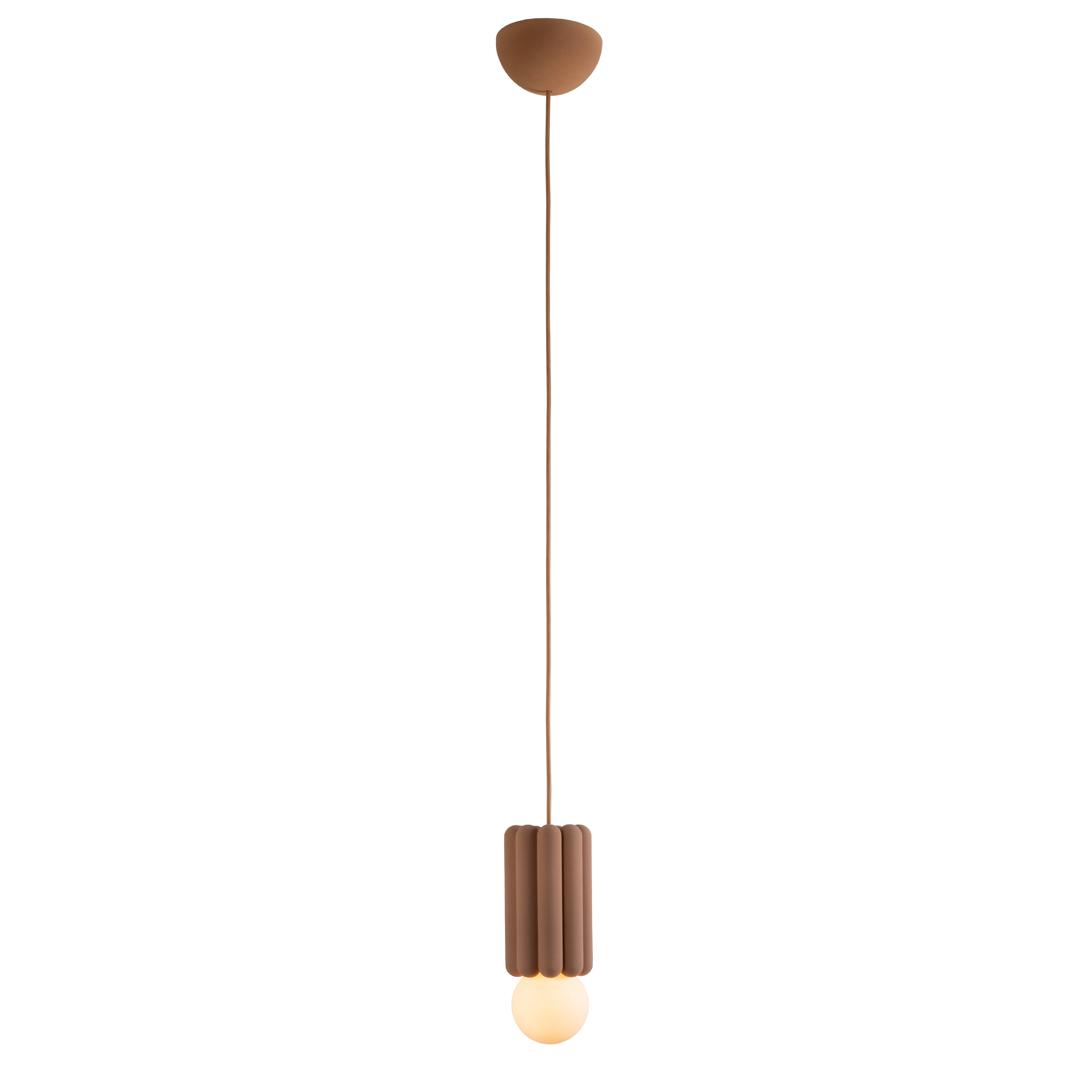 The Stucco No. III pendant light by Schneid features a brown ceiling mount and cord, with a ribbed cylindrical design that holds an exposed round bulb. It emits a warm glow, embodying a minimalist and modern aesthetic with creative luminosity.