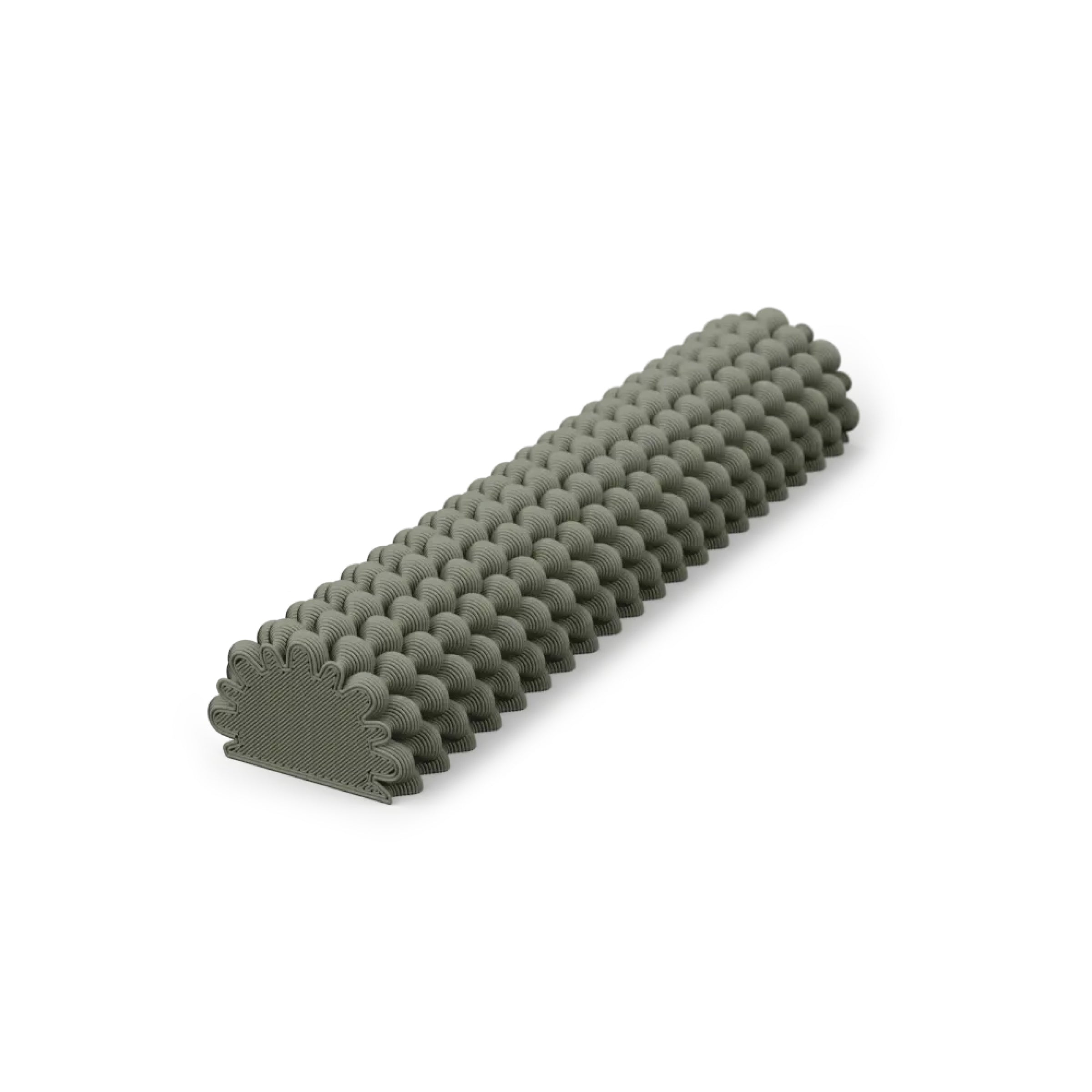 The Hoyt 29g Mezuzah by Sheyn features a unique, textured cylindrical design with scalloped edges, resembling a stylish dark green tire tread. Displayed diagonally on a white background, it highlights innovative 3D printing techniques that transform everyday items into artful creations.