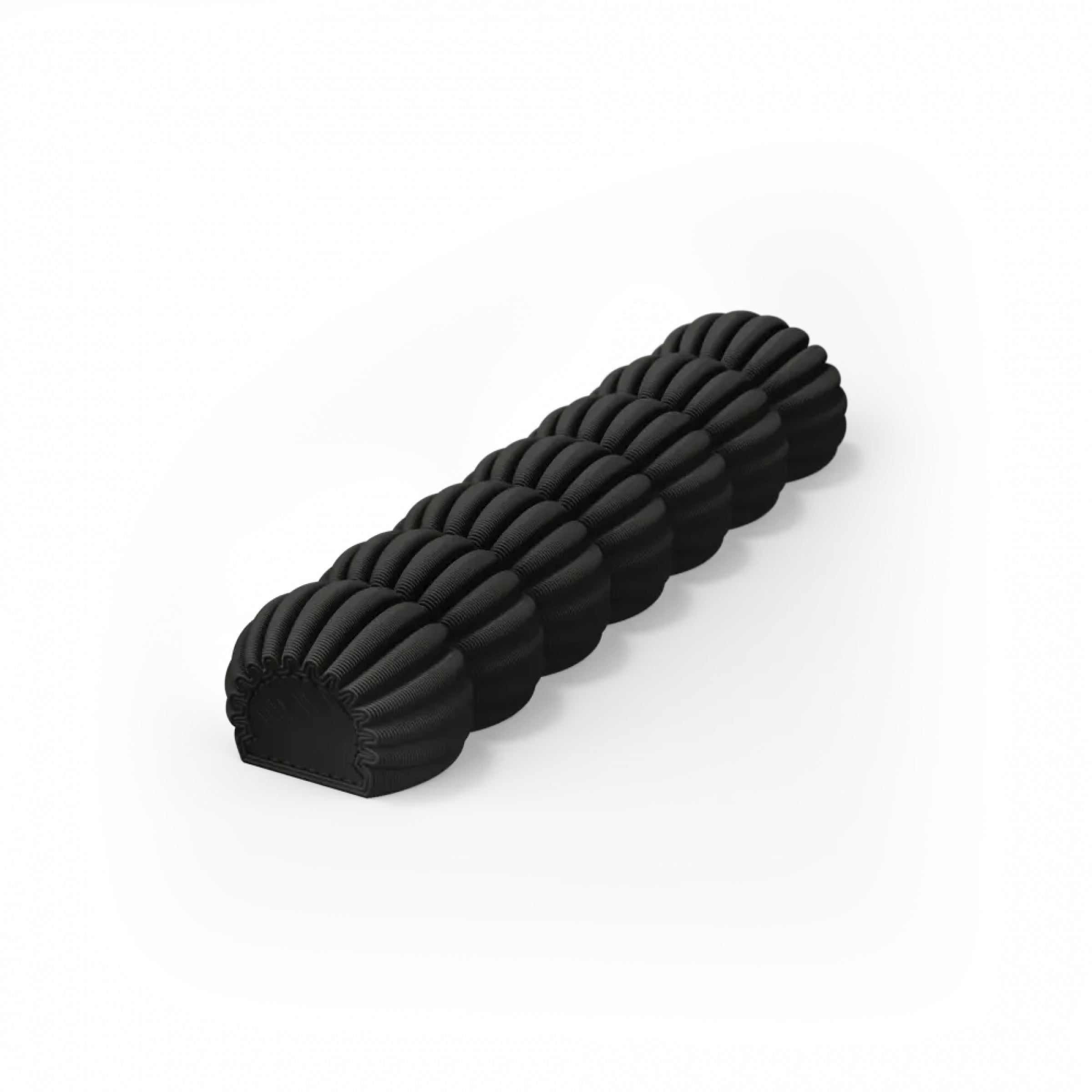The Zayl 30g Mezuzah by Sheyn features a black, textured roller made from an ecological compound with rounded, ribbed segments aligned straight against a white background.