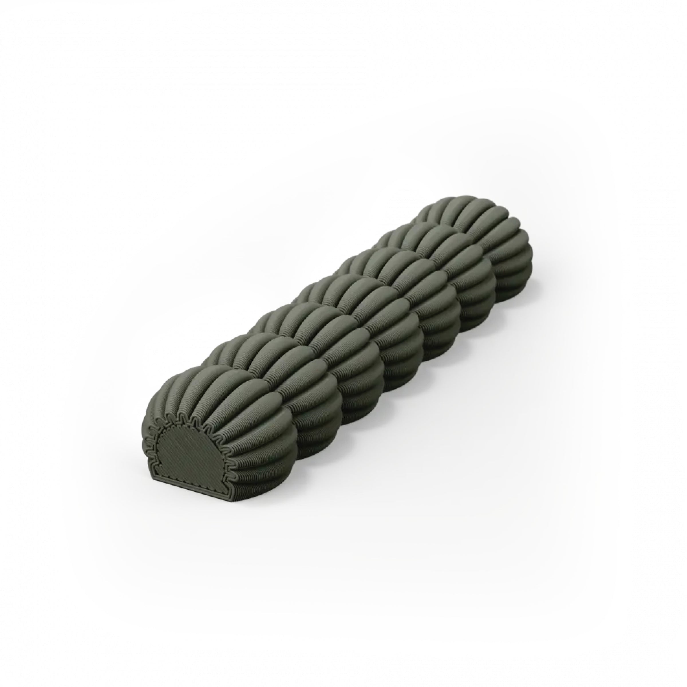 The Zayl 30g Mezuzah by Sheyn is a cylindrical foam roller with an eco-friendly composition, featuring a distinct segmented design with rounded ridges in dark green against a white backdrop.