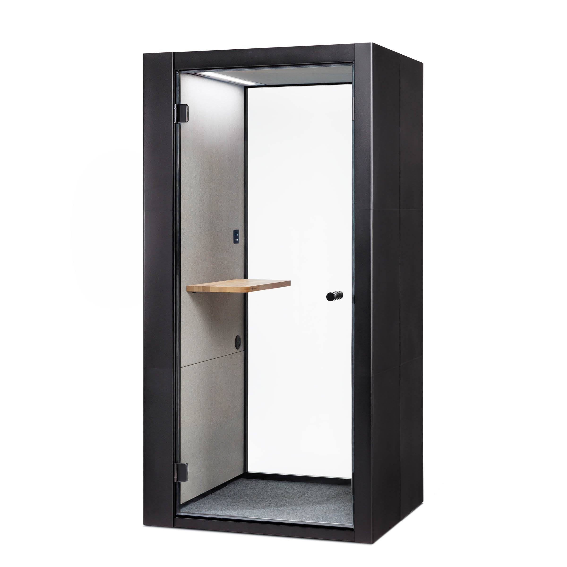 The OFFICE POD SPARK by SilentLab is a sleek, modern black telephone booth with a clear glass door, featuring a minimalist interior and small wooden shelf. It offers mechanical resistance and call privacy, making it perfect for production hall spaces.
