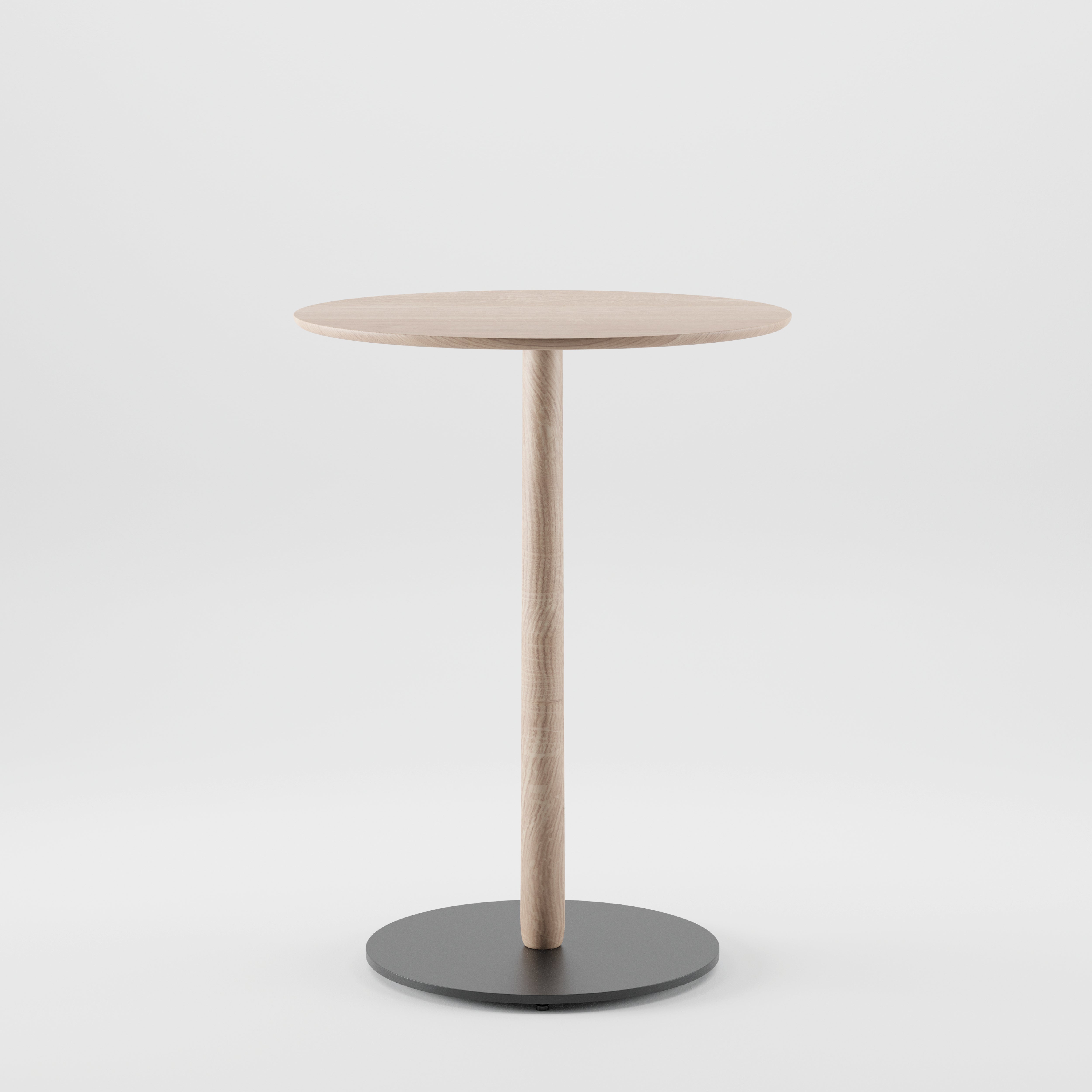 The Artisan Bistro B Table is a minimalist round wooden table with a single central leg and a circular black base. Crafted from solid wood using eco-friendly materials, it stands elegantly against a plain white background.