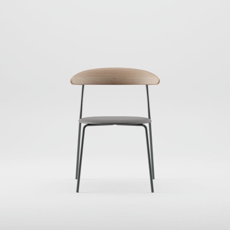 The KINU Chair by Artisan showcases a solid wood backrest treated with natural oils, complemented by black metal legs and a dark gray seat cushion. Crafted from eco-friendly materials, its modern minimalist design stands out against a plain white background.