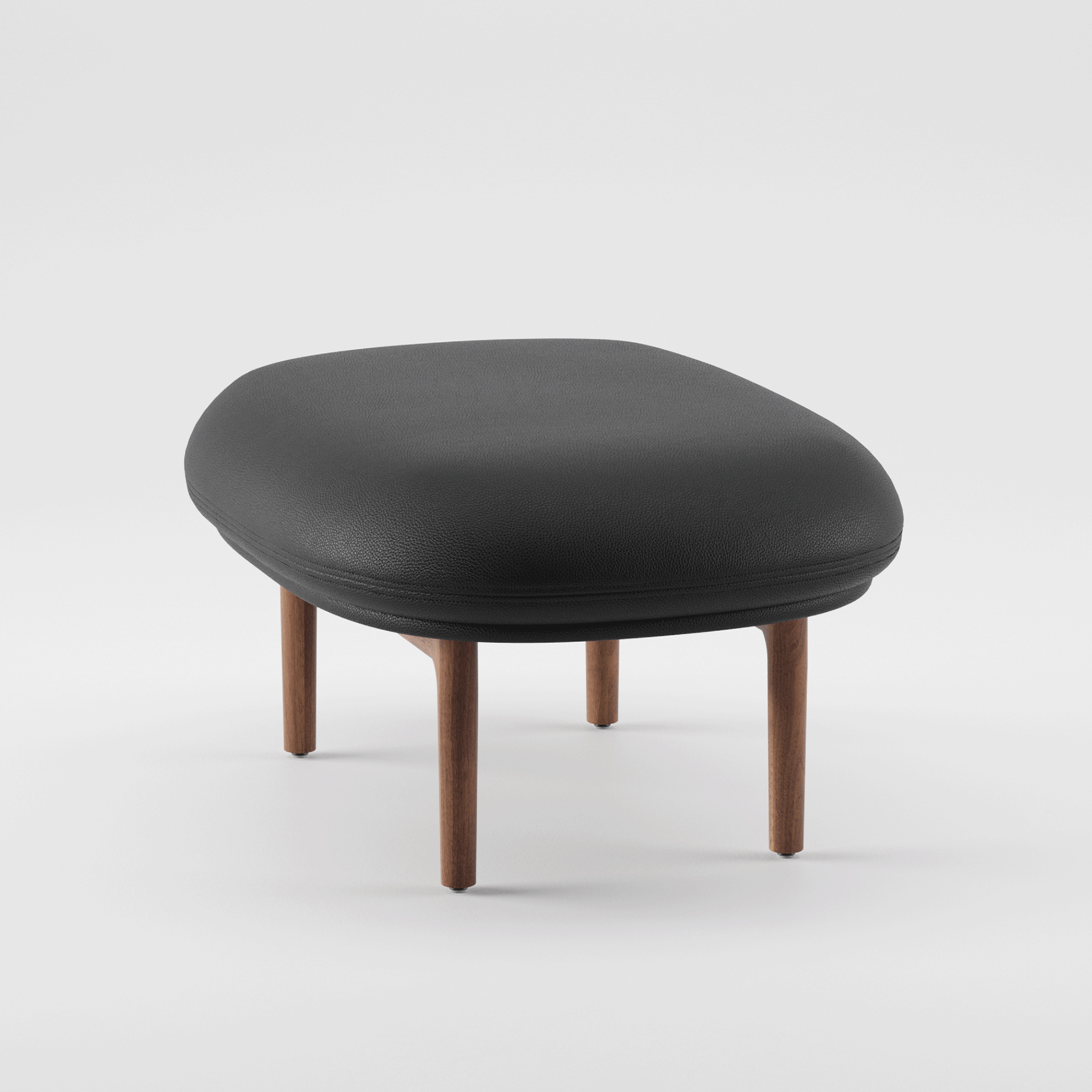 Introducing Artisans MELA Ottoman: a contemporary black leather piece with a smooth, rounded cushion resting on a detailed wooden base. Its minimalist design makes it pop against a plain white backdrop.