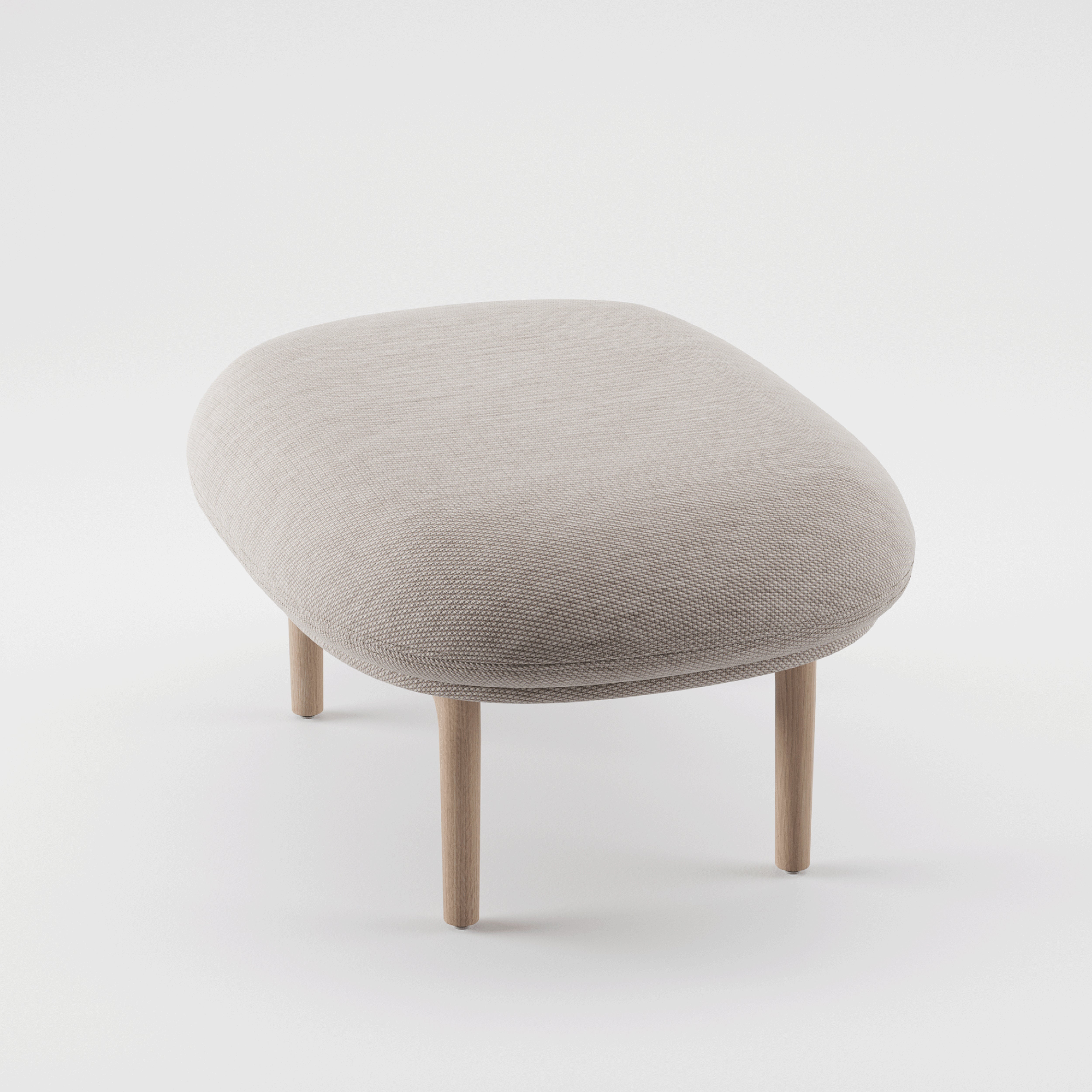 Introducing the Artisan MELA Ottoman: a beige, cushioned stool with an upholstered shell and rounded edges, elegantly set on a sturdy wooden frame against a pristine white background.