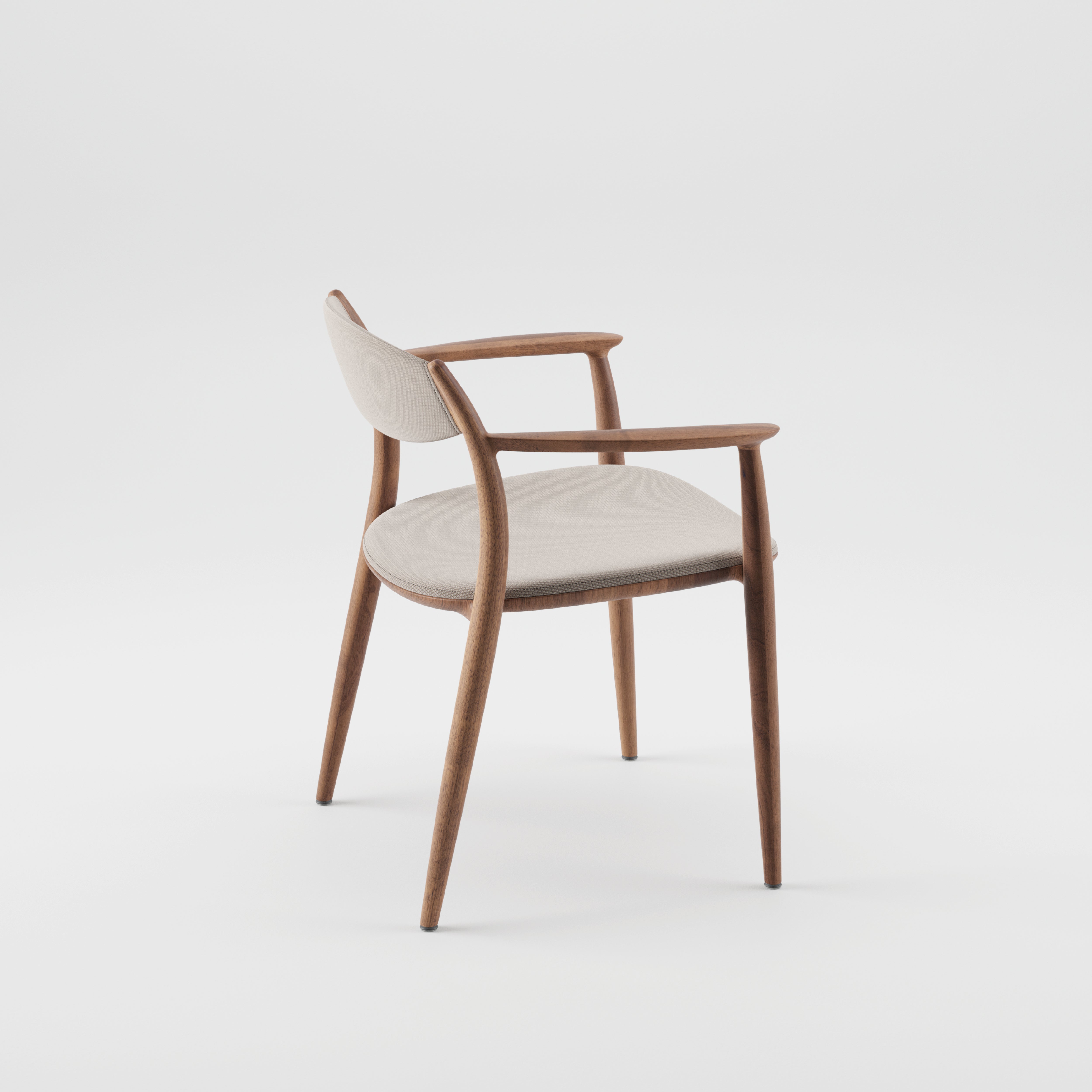 The Artisan NILA Chair is an elegant mid-century modern piece featuring a curved wooden frame crafted from solid wood, complemented by a beige cushioned seat and backrest, set against a plain white background.