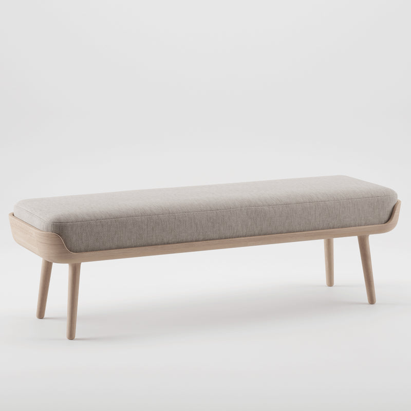 The THOR Bench by Artisan features a modern design with a natural wood frame, four legs, and a light gray cushioned seat. Set against a plain white background, it highlights its minimalist design crafted from eco-friendly materials.