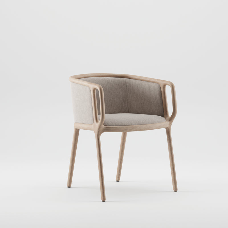 The VELO Chair by Artisan is a modern piece with a curved solid wood frame and light gray cushion. Both the padded backrest and seat use eco-friendly materials and natural oils. Its minimalist design elegantly contrasts against a plain white background.