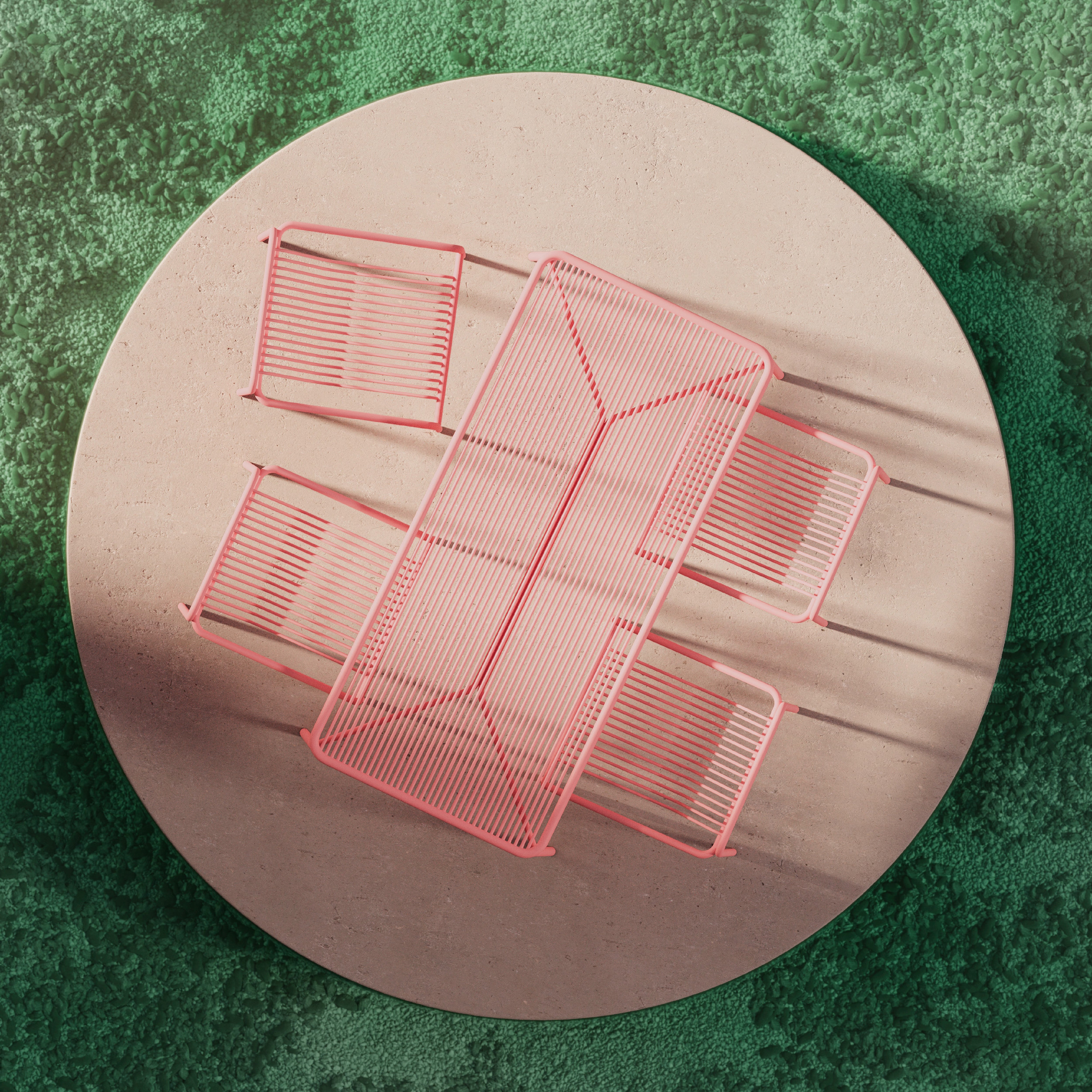 The IVY Outdoor Set by Objekte unserer Tage features a round, beige table on a green textured surface with matching pink metal bench and two chairs. They have an ergonomic slatted design casting shadows and offer a modern, artistic aesthetic while being weather resistant.