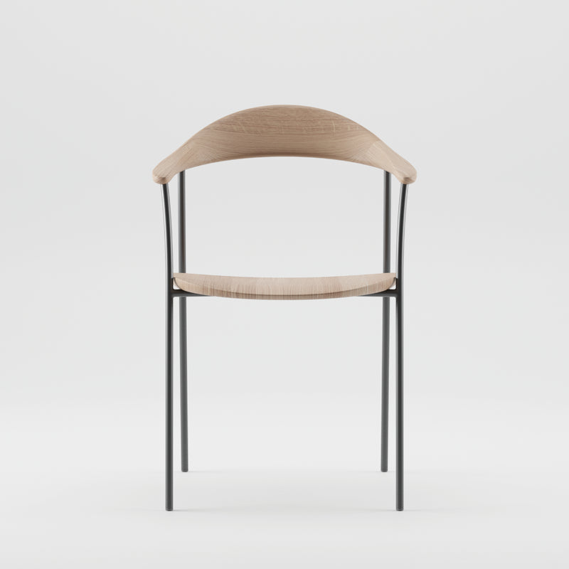 The Artisan NEVA contour chair offers a modern minimalist design, featuring a CNC-carved wooden seat and backrest. Its metal frame with thin, sleek legs enhances the contemporary style, standing out vividly against a plain white background.