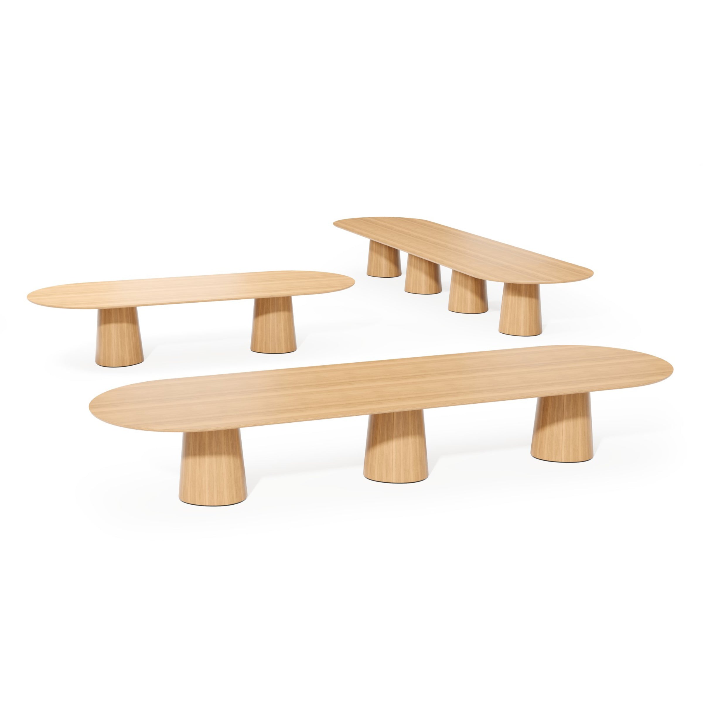 Displayed on a plain white background are three P.O.V. Plus Table 481 units by TON, featuring oblong wooden tops and cylindrical legs. Crafted as versatile modular tables, their varying heights and sizes make them ideal for both office and dining settings.