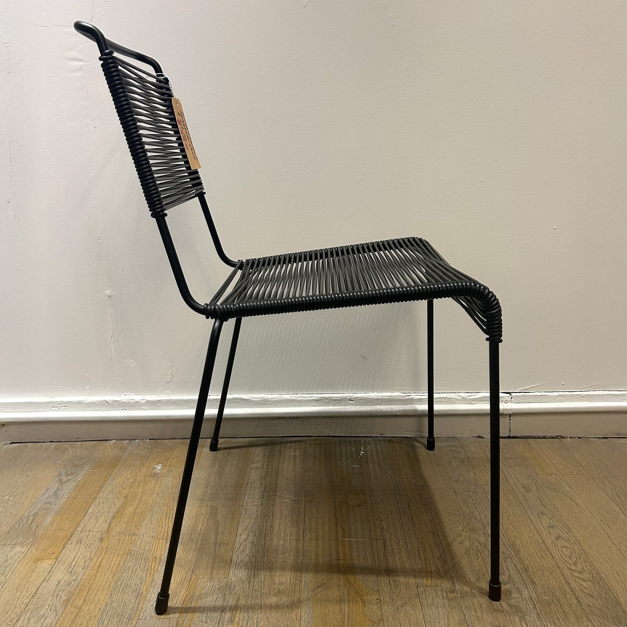 TT54 Spaghetti chair with black steel rod frame and plastic string seat and backrest, modern minimalist design on sale.