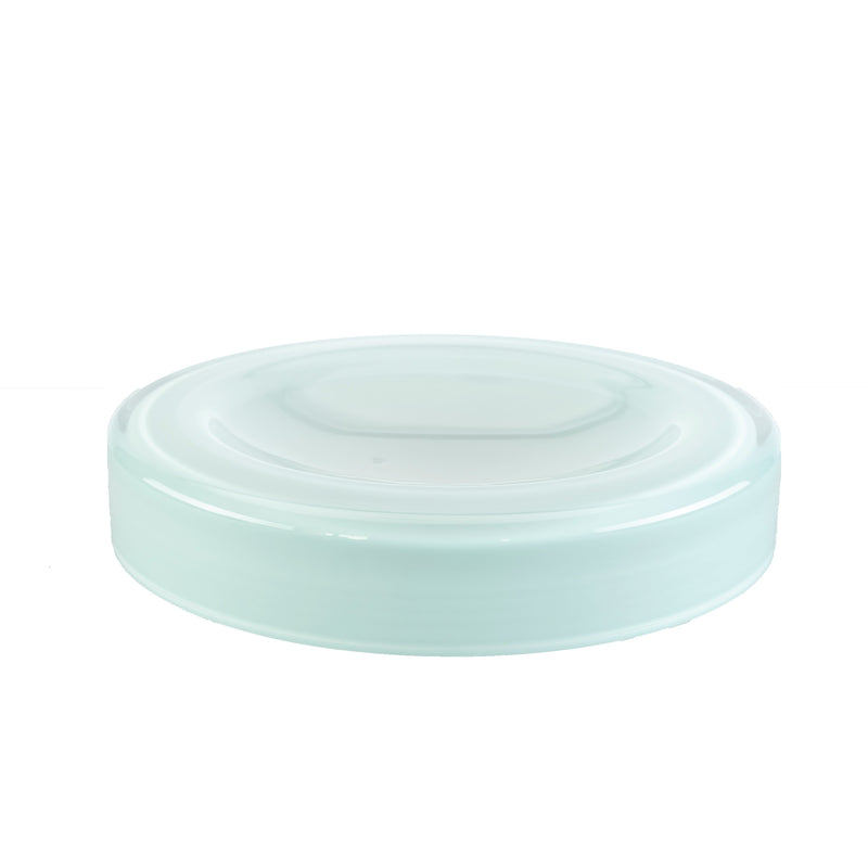 The WET Bowl Big by Ursula Futura features a round, mint-green glass lid with a smooth surface and slightly raised rim, echoing its handmade design, displayed flat against a plain white background.