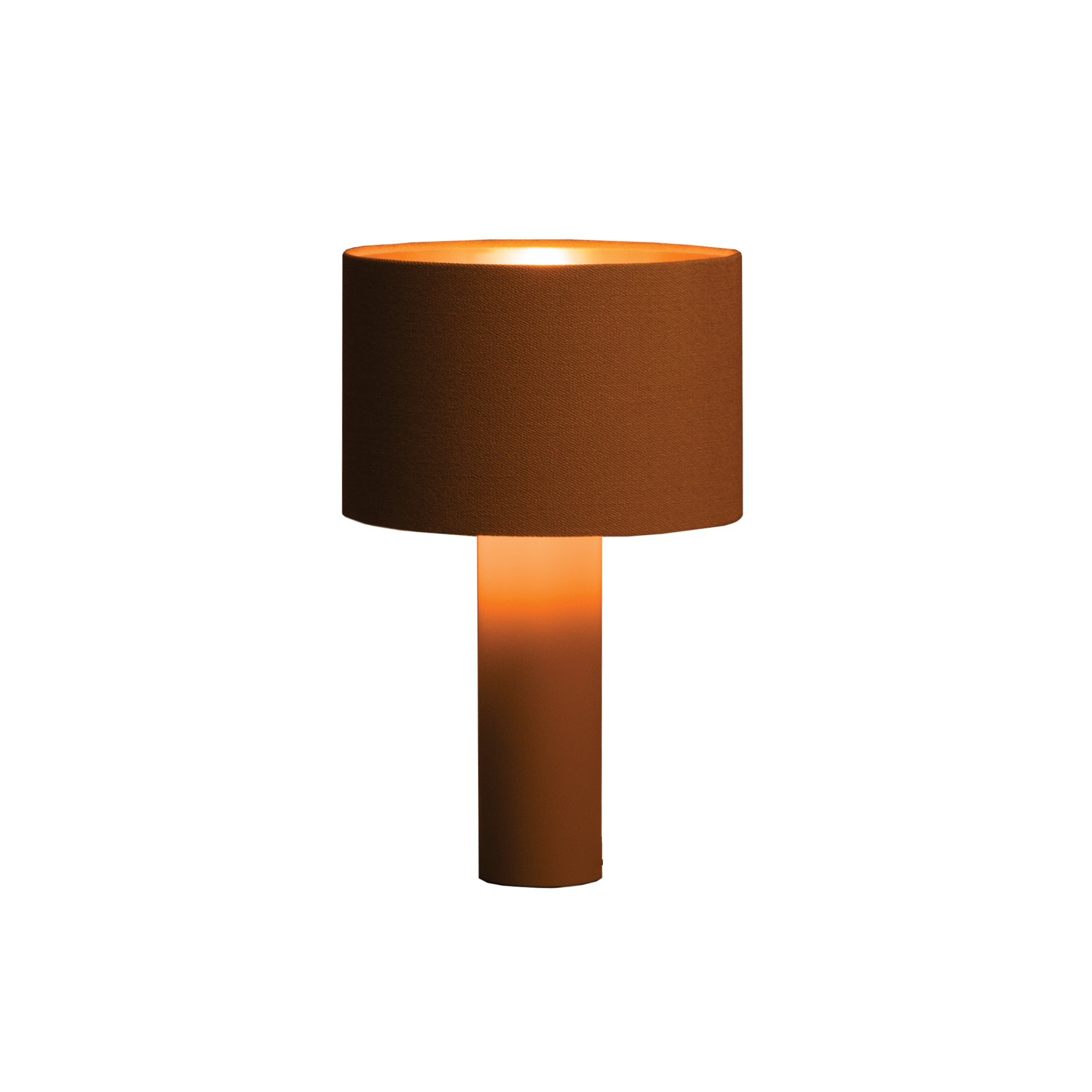 The ALL ROUND Table Lamp by Victor Foxtrot features a brown, powder-coated steel cylindrical base and a wool fabric lampshade. It emits warm ambient light against a white background.