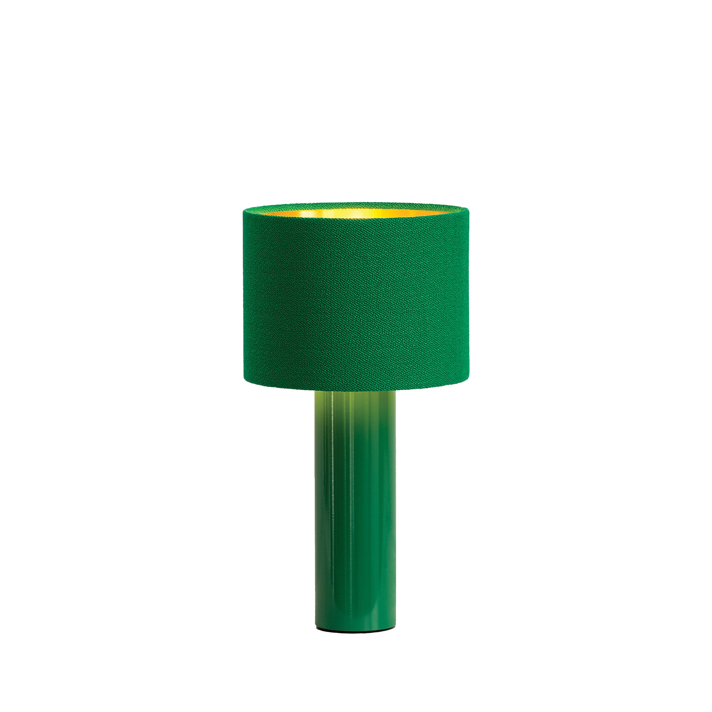 The ALL ROUND MINI Table Lamp by Victor Foxtrot is a modern green lamp with a cylindrical base and wool fabric shade that emits a warm yellow light, offering a gentle glow that softly contrasts its cool green design.