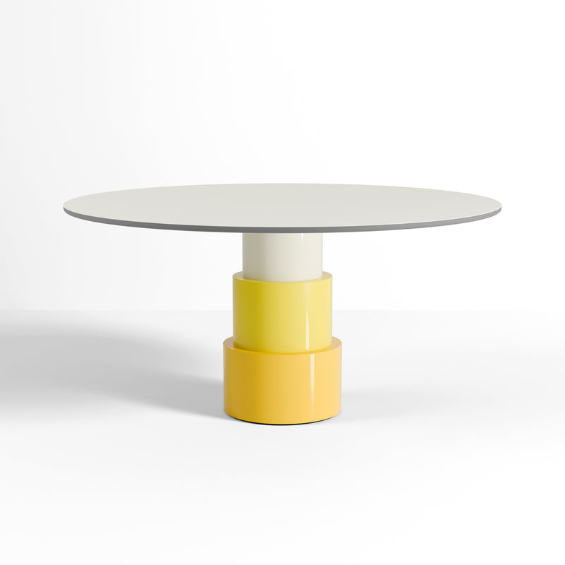 U Turn Table Linoleum with slim floating top and three yellow tapered cylinder base in modern design.