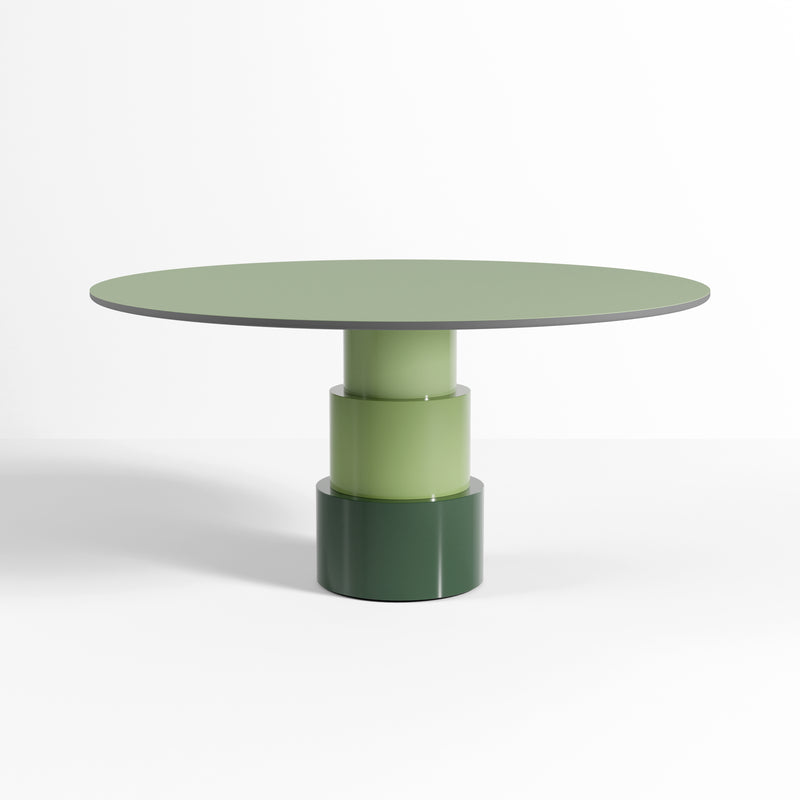 U Turn Table Linoleum with ocean blue linoleum top and green modular tapered cylinder base, sleek modern design.