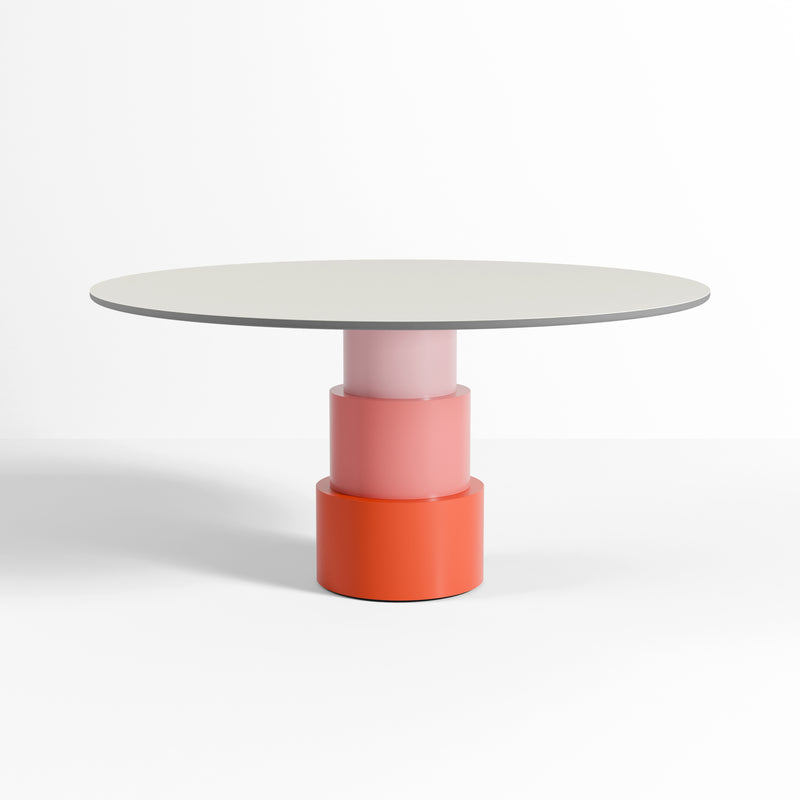U Turn Table Linoleum with round linoleum top and colorful three-tiered cylindrical powder-coated steel base.