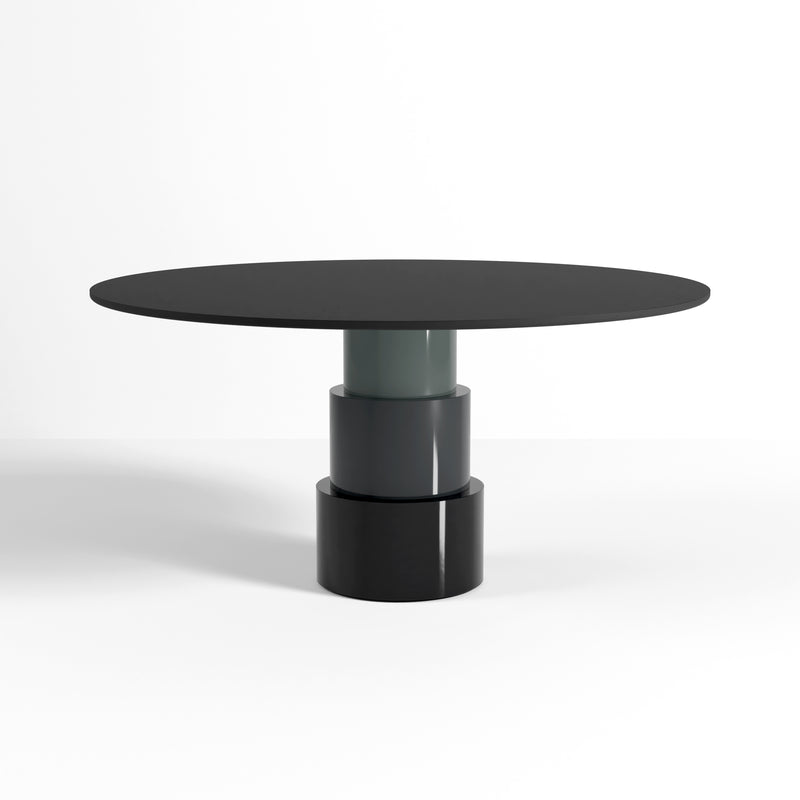 U Turn Table Linoleum with ocean blue powder-coated steel base and slim floating linoleum top in a modern design.