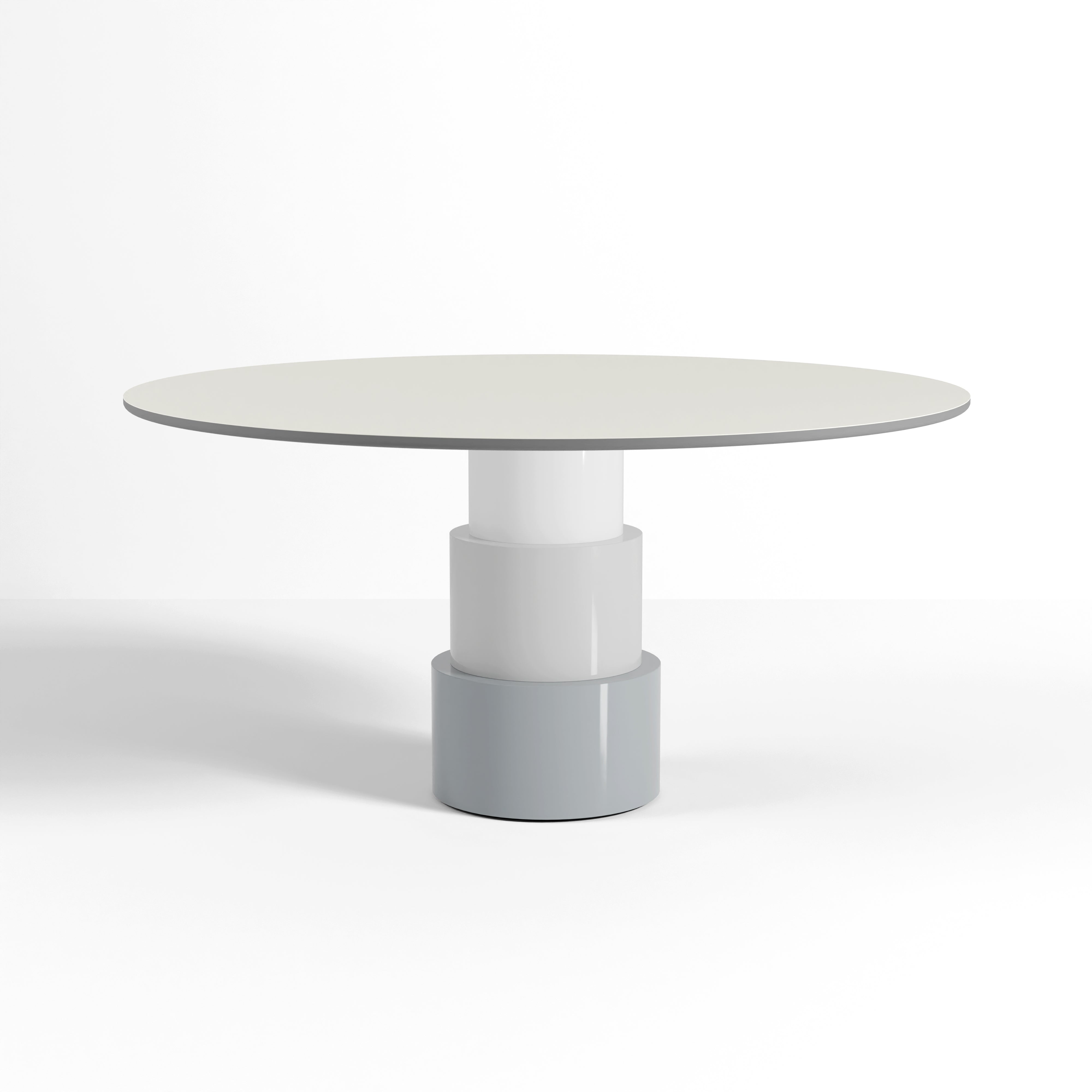 U Turn Table Linoleum with a slim round top and three-tiered cylindrical powder-coated steel base in ocean blue.