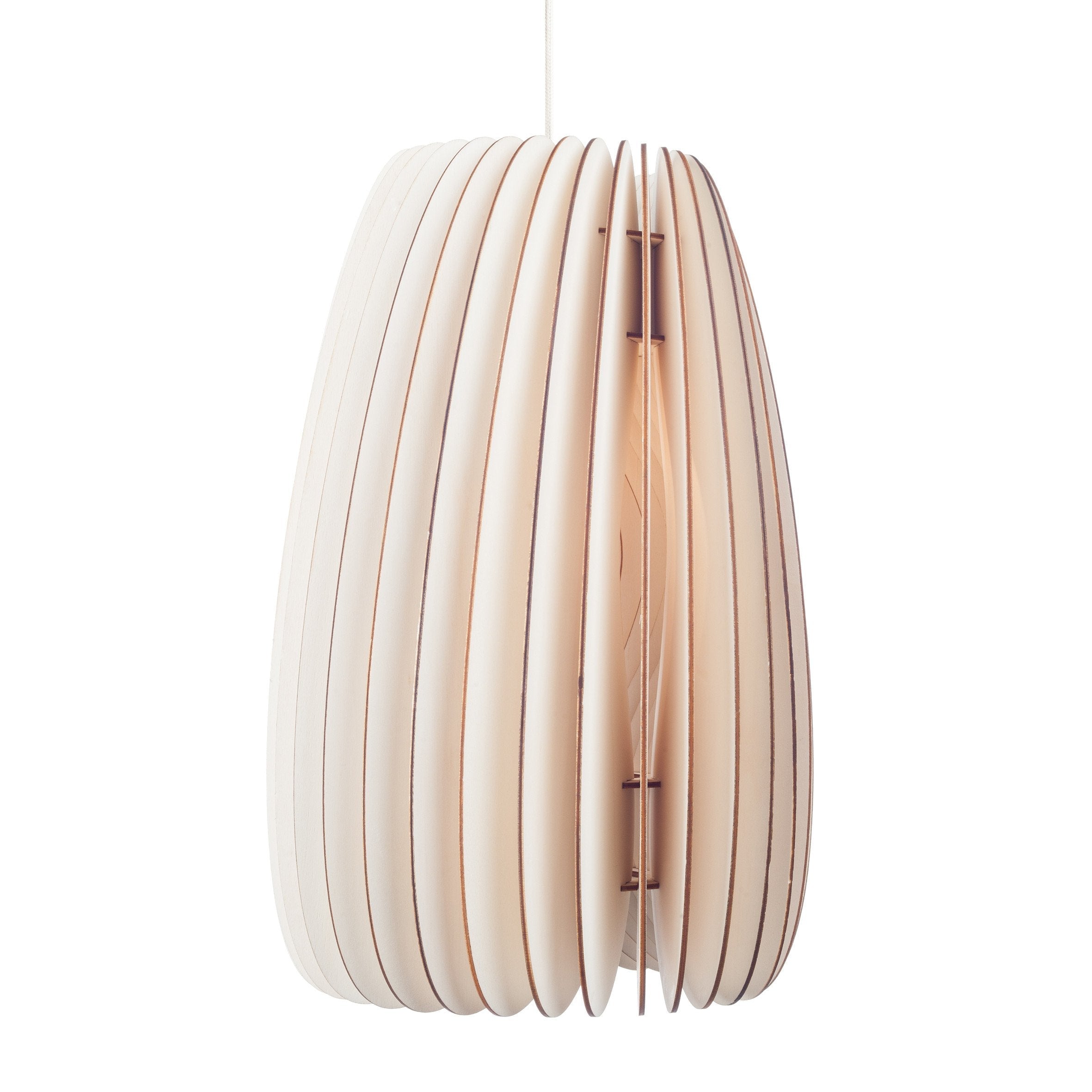 The Secundum pendant light by Schneid, in a modern white design, boasts evenly spaced vertical slats forming an elongated oval. It radiates a warm glow from within, offering a gentle contrast to its sleek exterior and elegantly suspends from the ceiling via a thin cord.
